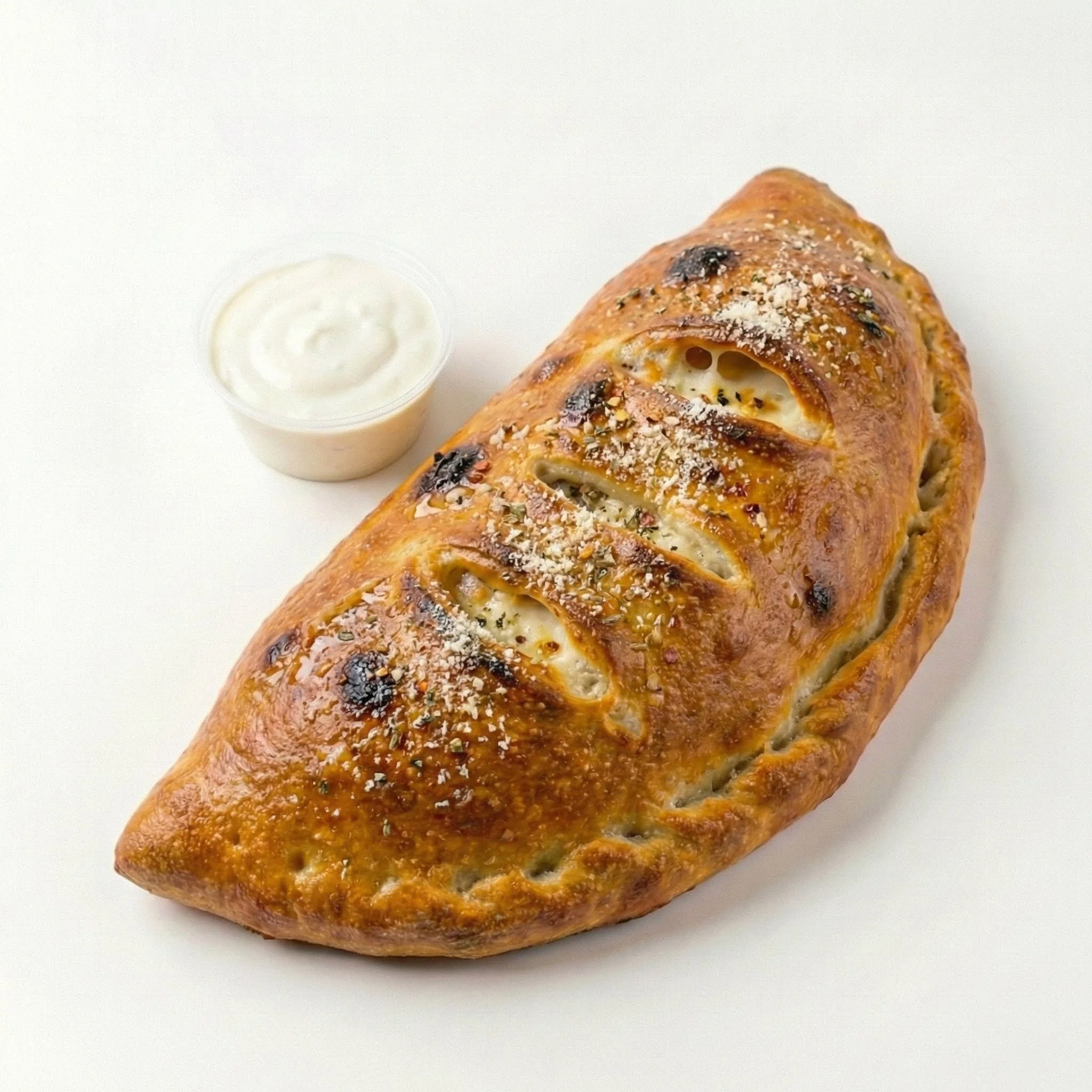 The Hellcat – Spicy & bold with shredded chicken, smoked bacon, jalapeños, cheddar, buffalo drizzle, served with blue cheese dressing