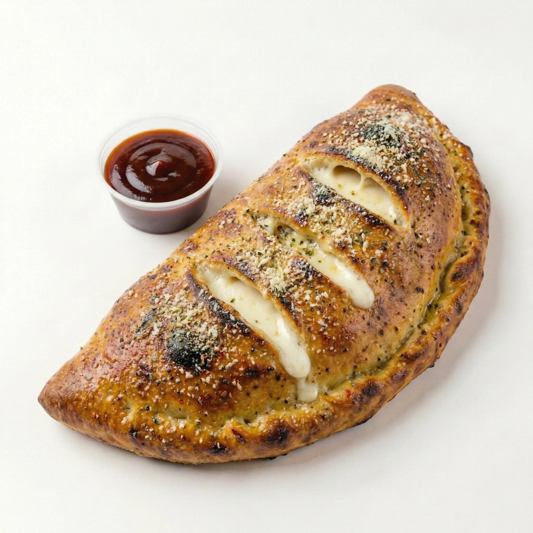 The El Camino – sweet & tangy with shredded chicken, Canadian bacon, pineapple, red onion, BBQ drizzle, served with BBQ sauce