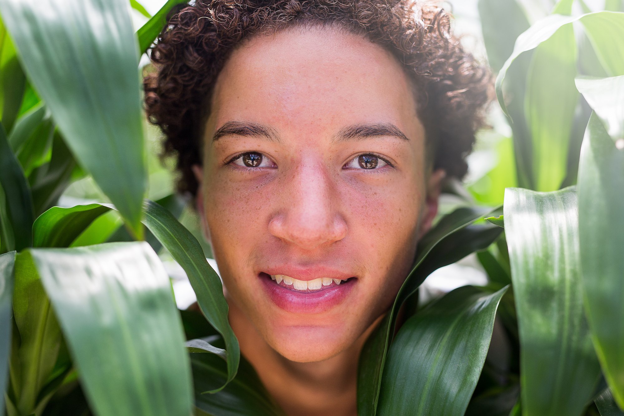 Jason Michael Bryant Photography Portraits Twins 2016 San Antonio Texas Teen Smile Plants Plant curly hair Boy copy.jpg