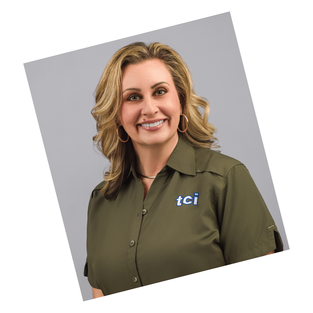 Professional corporate headshot of a smiling woman in an olive shirt with the TCI logo, taken by Meet the Bryants Photography in San Antonio.