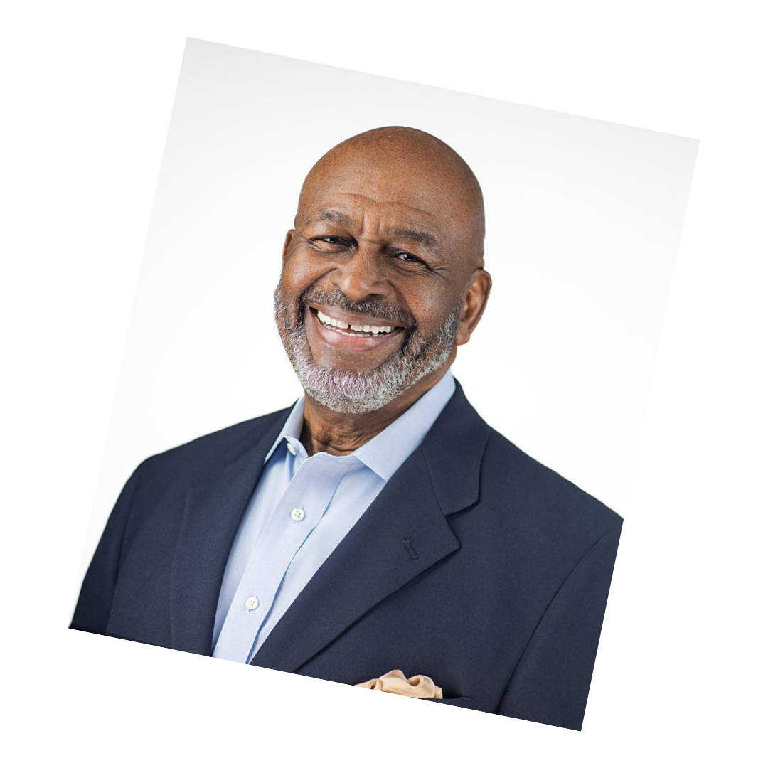 Executive headshot of a senior leader in a navy blazer smiling confidently