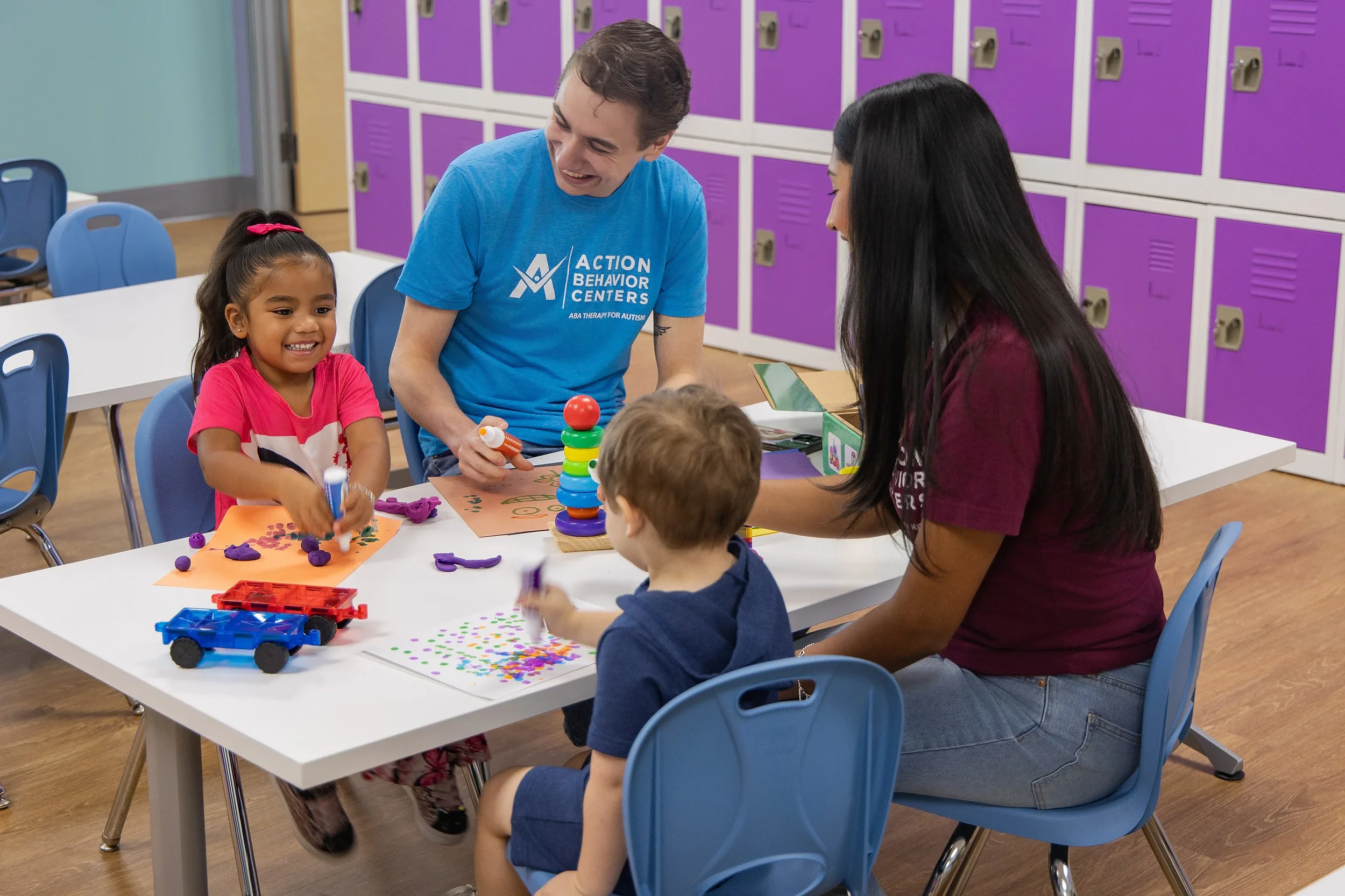 Therapists and children participating in a fun and interactive ABA therapy session at Action Behavior Centers in San Antonio, fostering social and developmental skills.