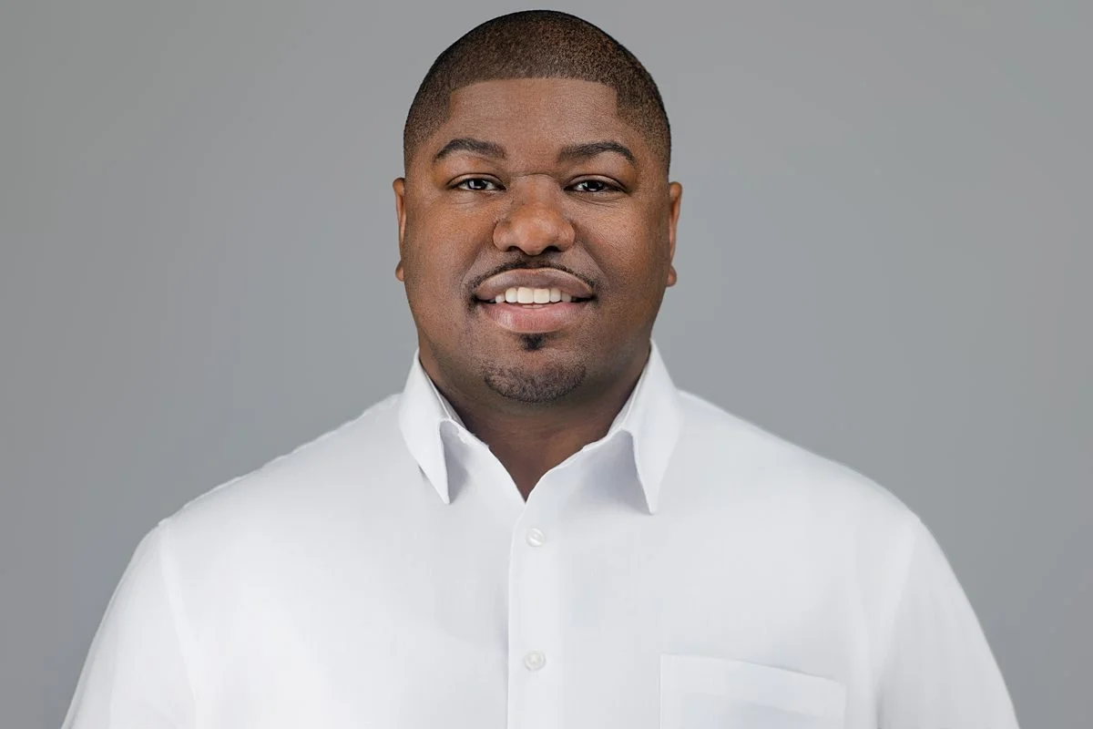Studio men’s headshot in San Antonio with crisp white shirt and polished look.