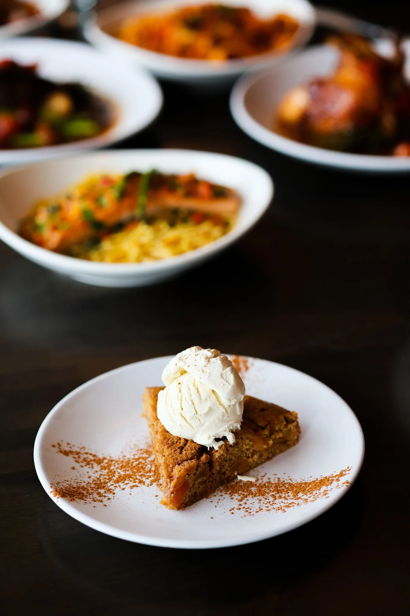 Decadent dessert plated with ice cream and cinnamon, food photography for a Bradenton, FL restaurant