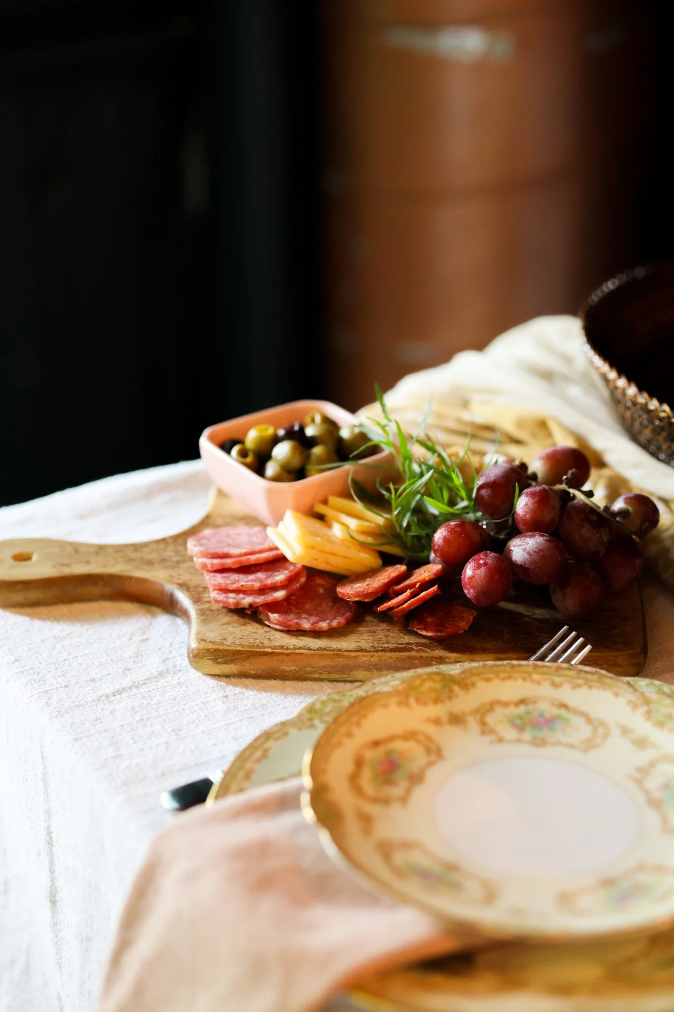 Charcuterie board with cured meats, cheeses, fruit and crackers set out for guests, food photography for a Saratoga Springs, NY event venue