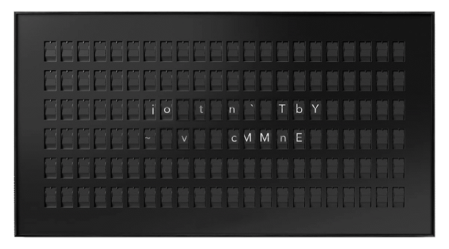 Retro-style split-flap display showing random letters and symbols in a grid layout.