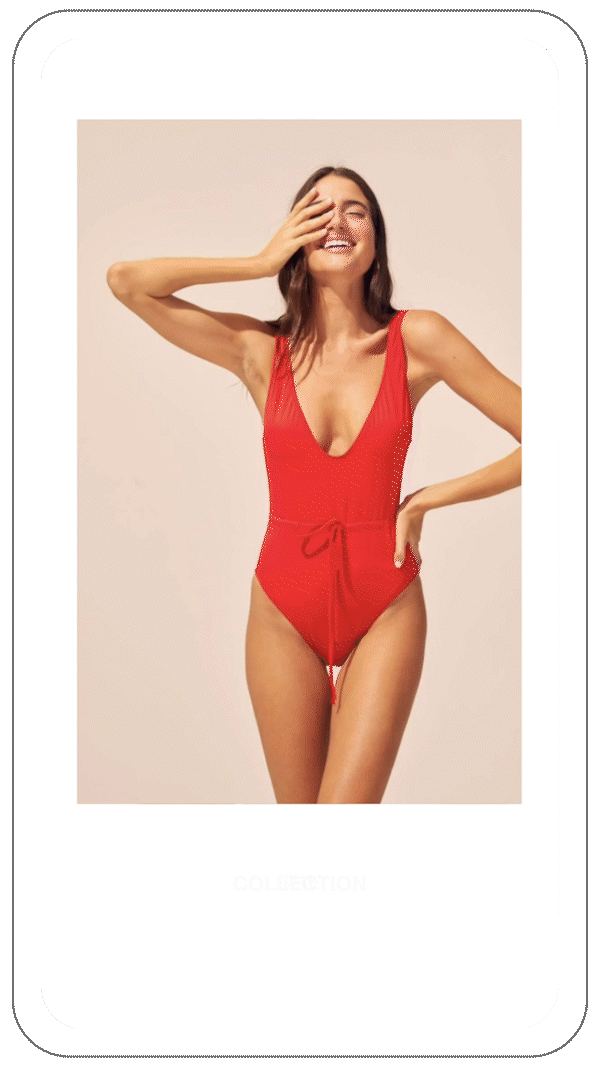 Smiling woman wearing a red one-piece swimsuit with a tie detail, standing against a plain background.