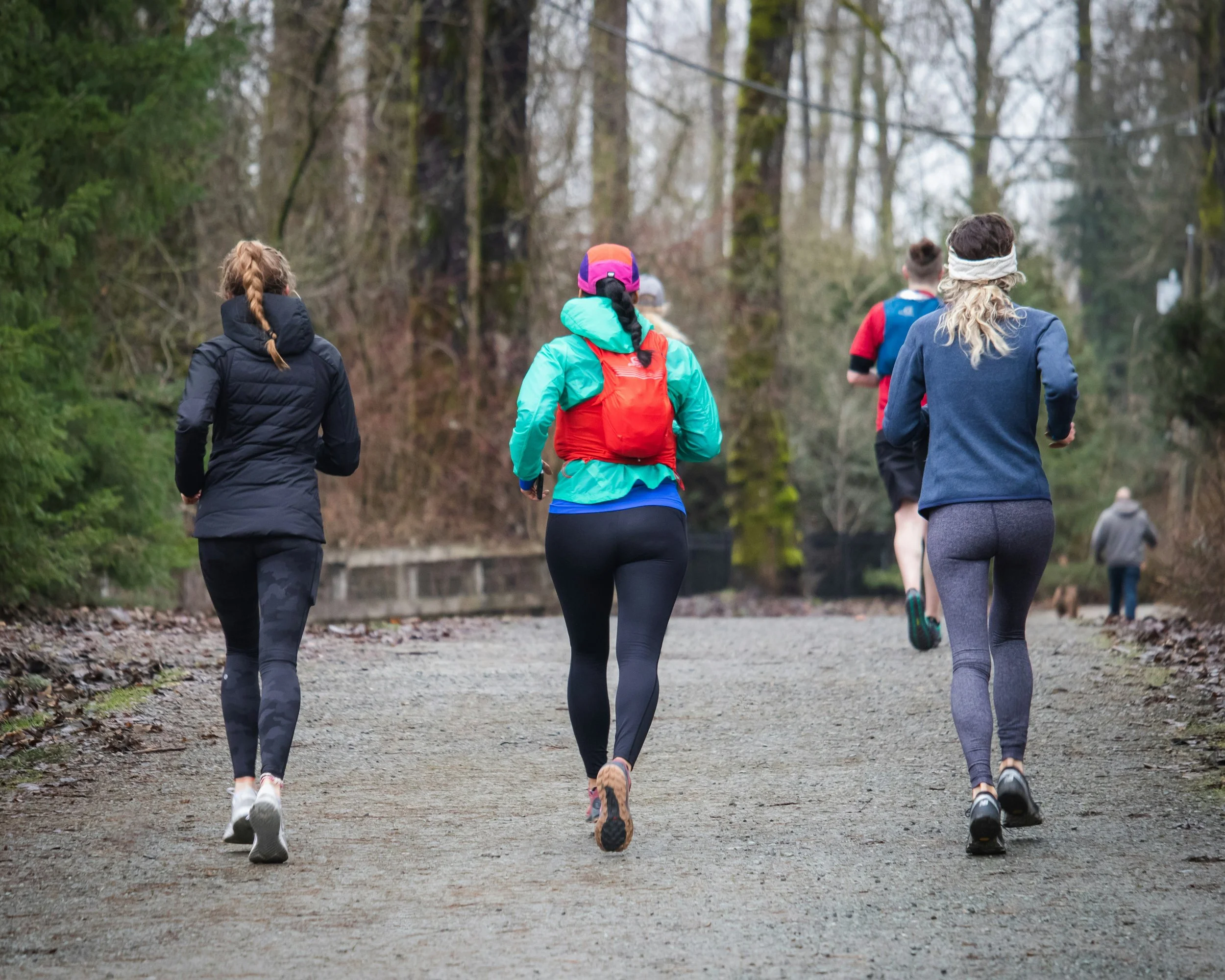 three athletes running outdoors_skadi collective online sports community
