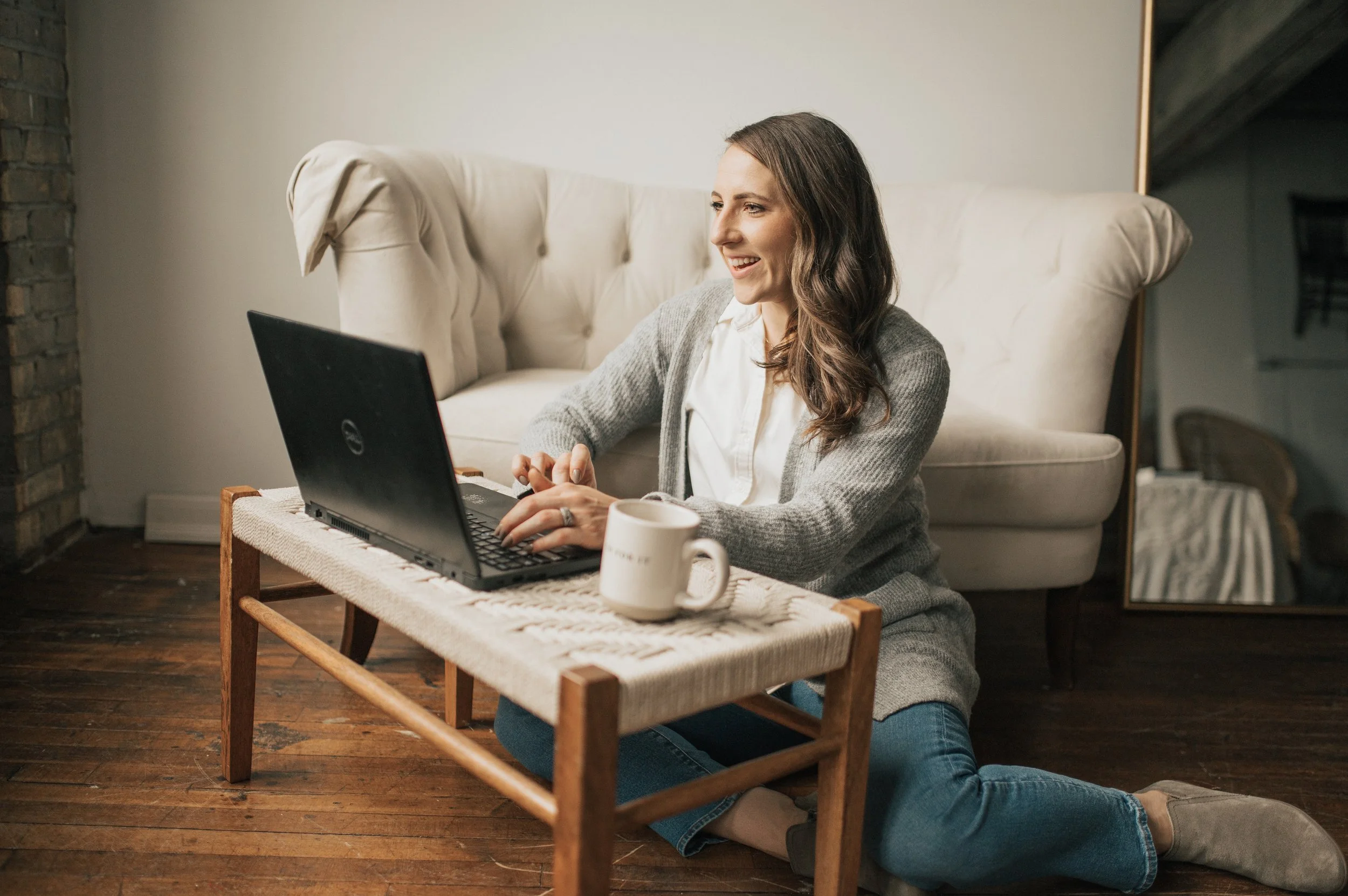 Dr. Erin Ayala working on laptop_skadi collective online sports community