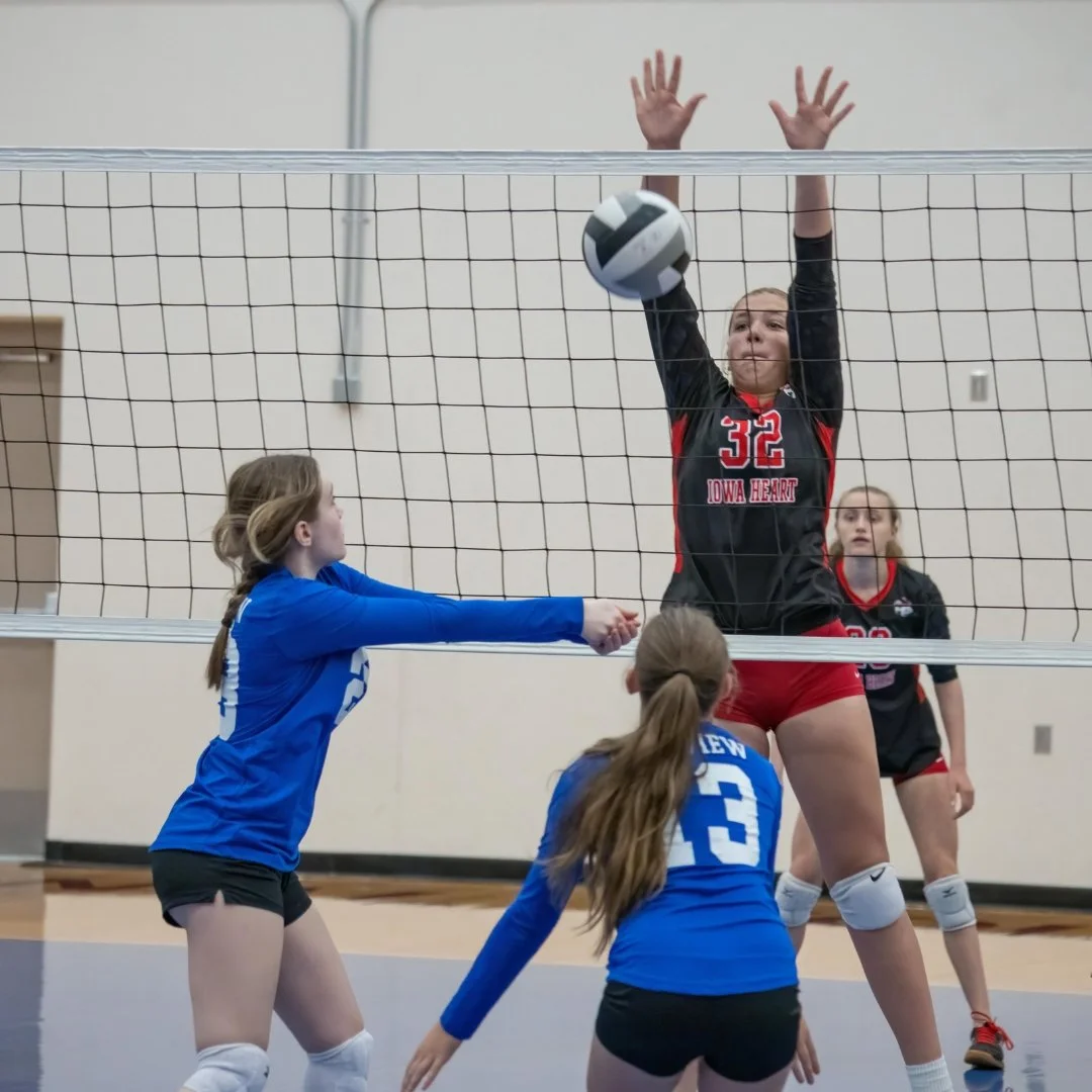 Volleyball players competing in a high-stakes match, illustrating performance anxiety in competitive team sports.