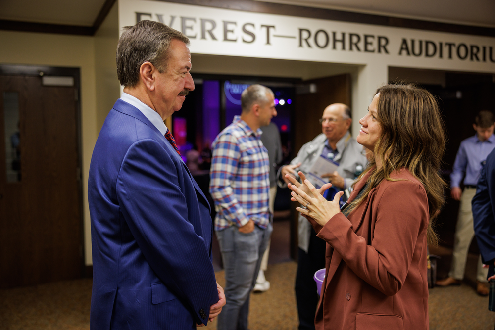 Attendees talking outside the Everest-Rohrer Auditorium
