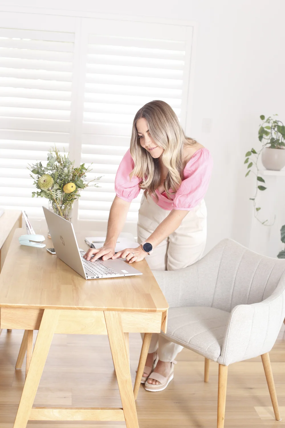 Mel working at her desk