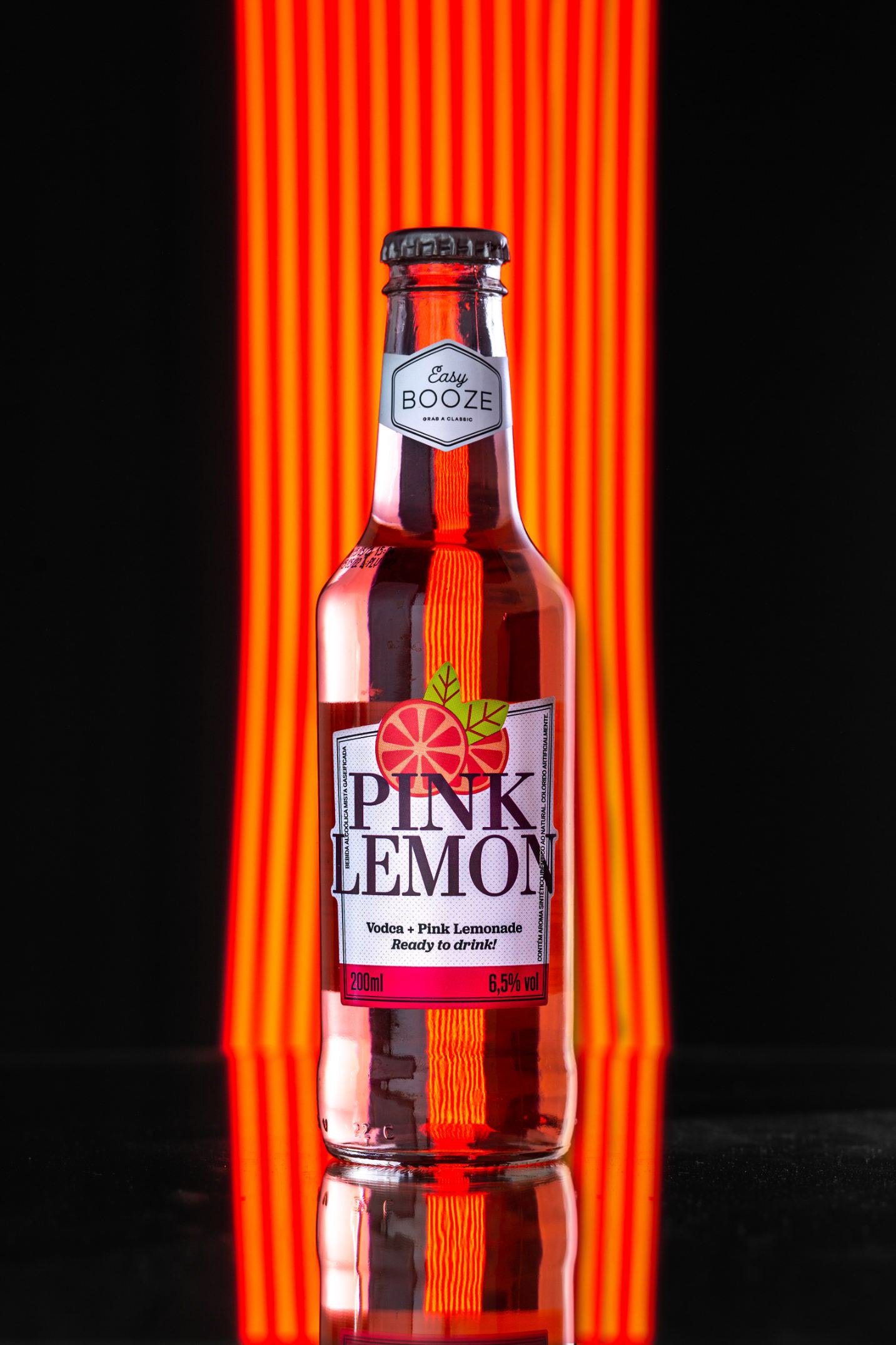 A bottle of Pink Lemonade featuring vodka and pink lemonade, set against a black background with glowing red neon lights.