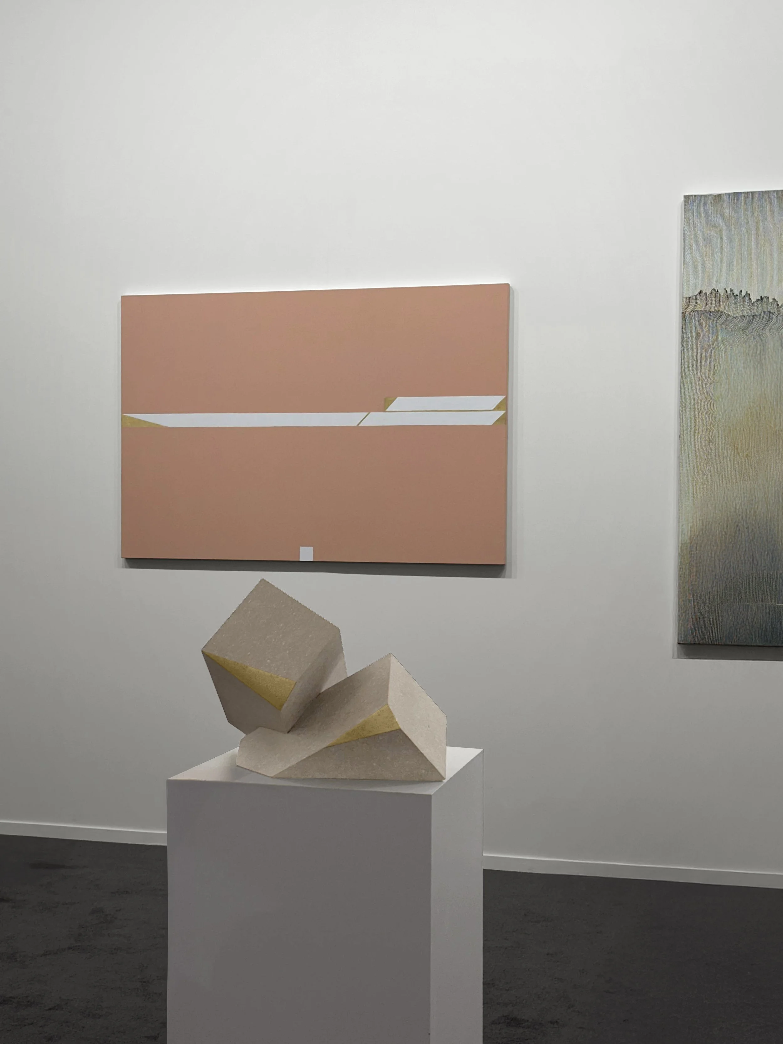 Tarek Elkassouf طارق القاصوف — Attachments exhibition at Art Dubai, UAE. Hand-carved limestone and 22k gold leaf sculptures exploring the tension between holding on and letting go.