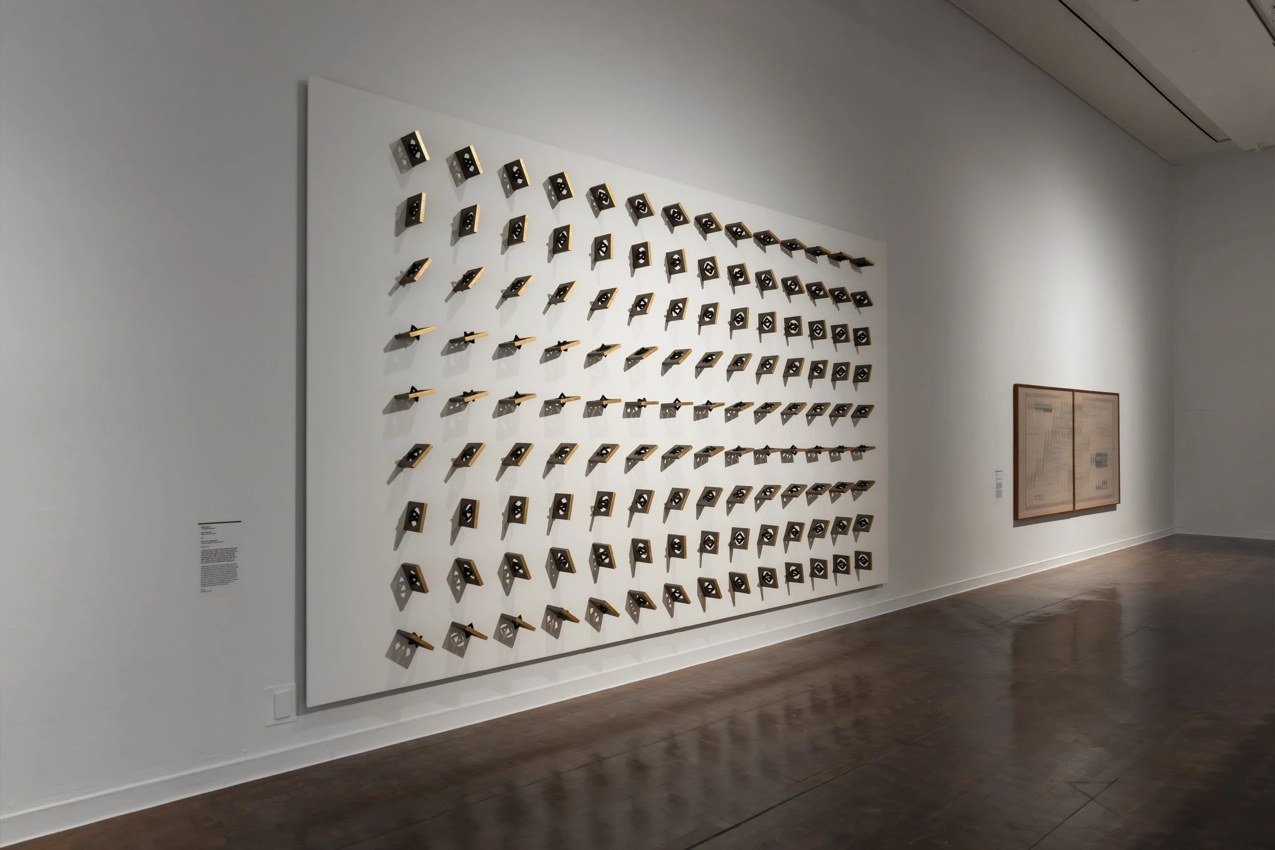 Where Are You From? — Selected by ADMAF for Proximities at Seoul Museum of Art (SeMA). Wall-mounted assembly of lava stone and 22k gold elements by Tarek Elkassouf. طارق القاصوف — 서울시립미술관