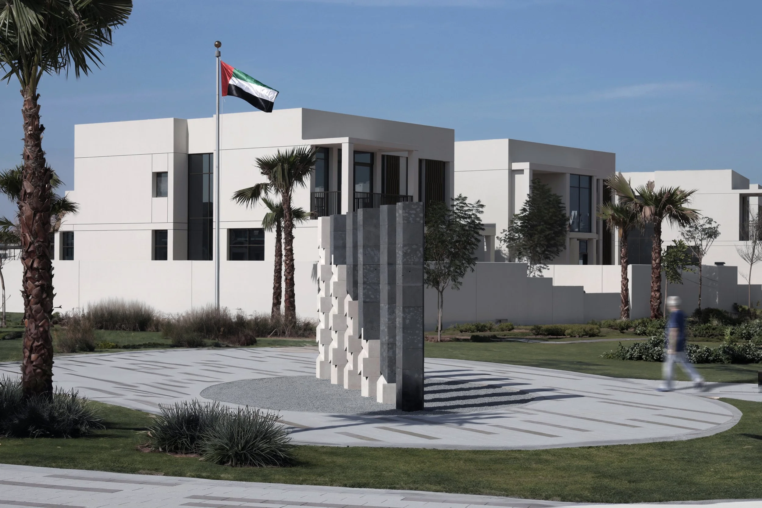 Tarek Elkassouf طارق القاصوف — Transformative Energy, record-breaking large-scale public artwork Jubail Island, Abu Dhabi. Monumental UAE installation, six pillars, limestone and basalt, first permanent sculpture of Jubail Public Art Programme.