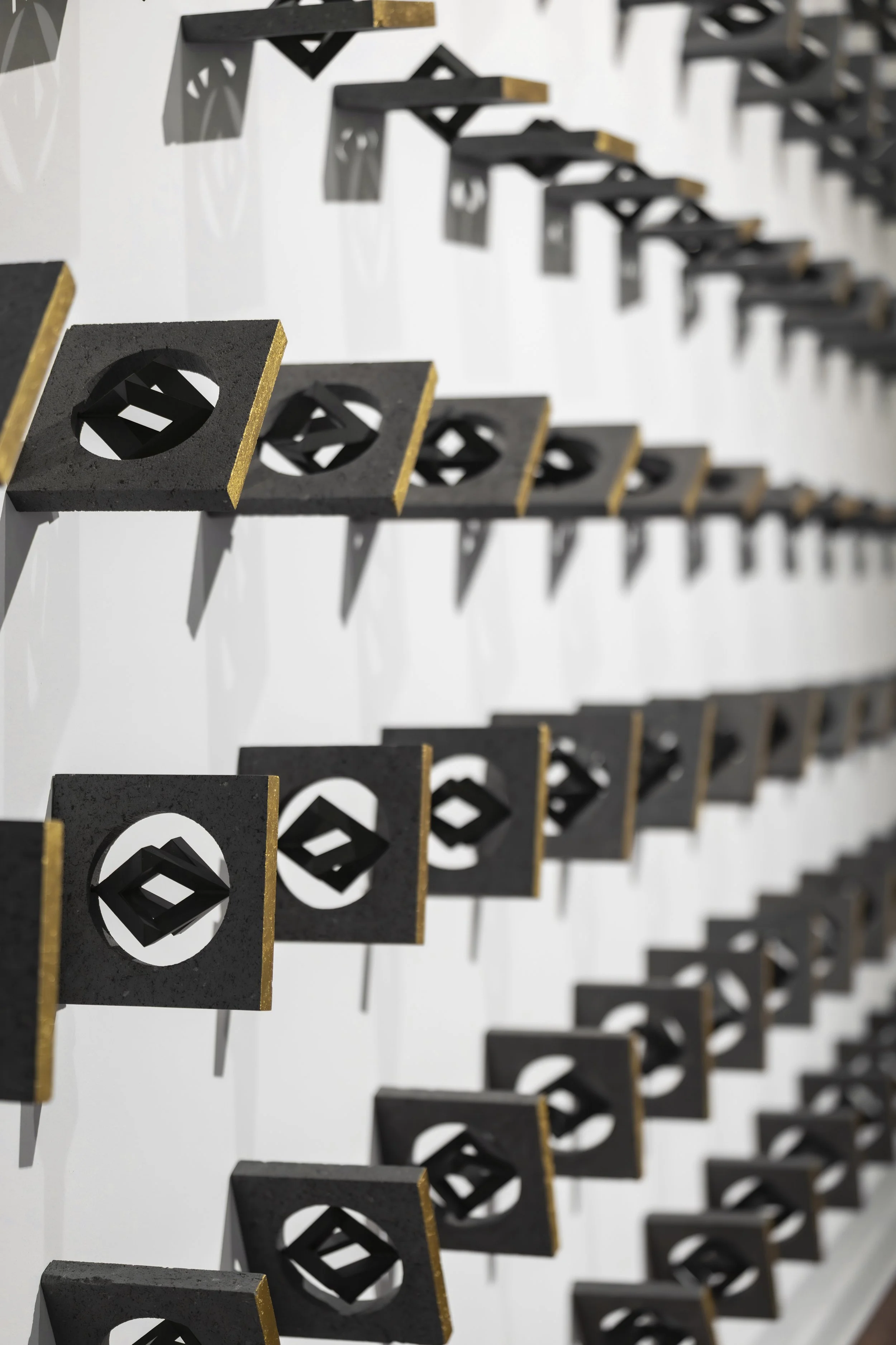 Where Are You From? — Selected by ADMAF for Proximities at Seoul Museum of Art (SeMA). A rhythmic detail of hand-carved lava stone and 22k gold by Tarek Elkassouf. طارق القاصوف — 서울시립미술관