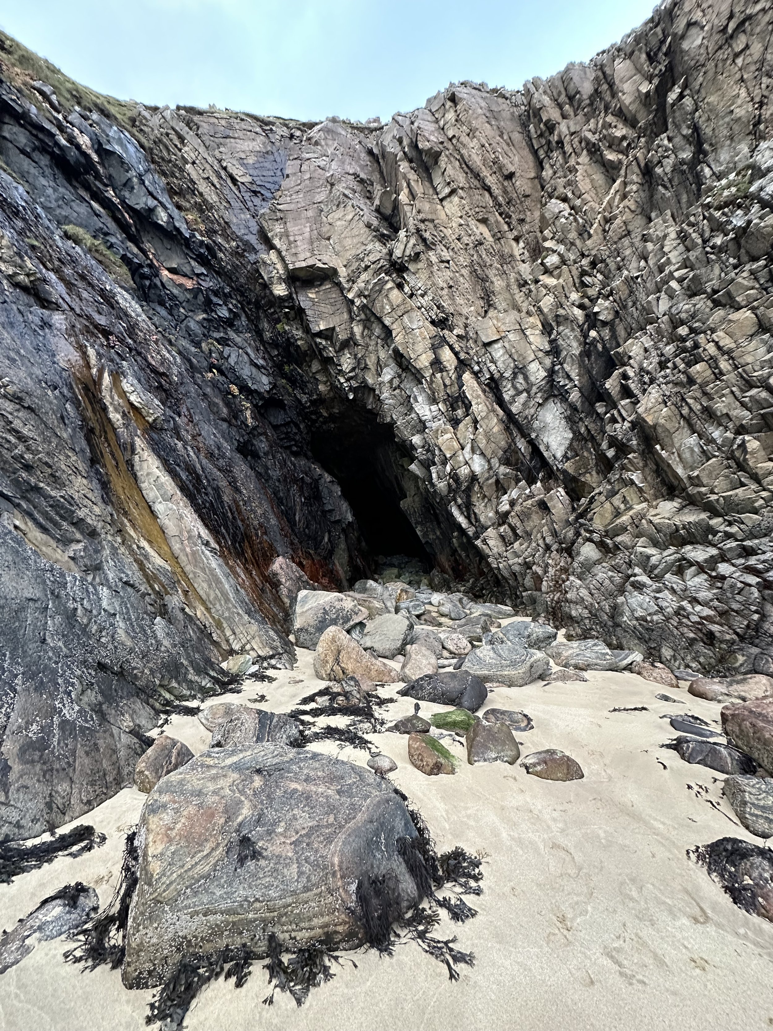 Miles starts his ascent, then sees to one side--
A WEIRD CAVE IN THE ROCK.
Marking its entrance: a cross drawn in chalk.
(p61)