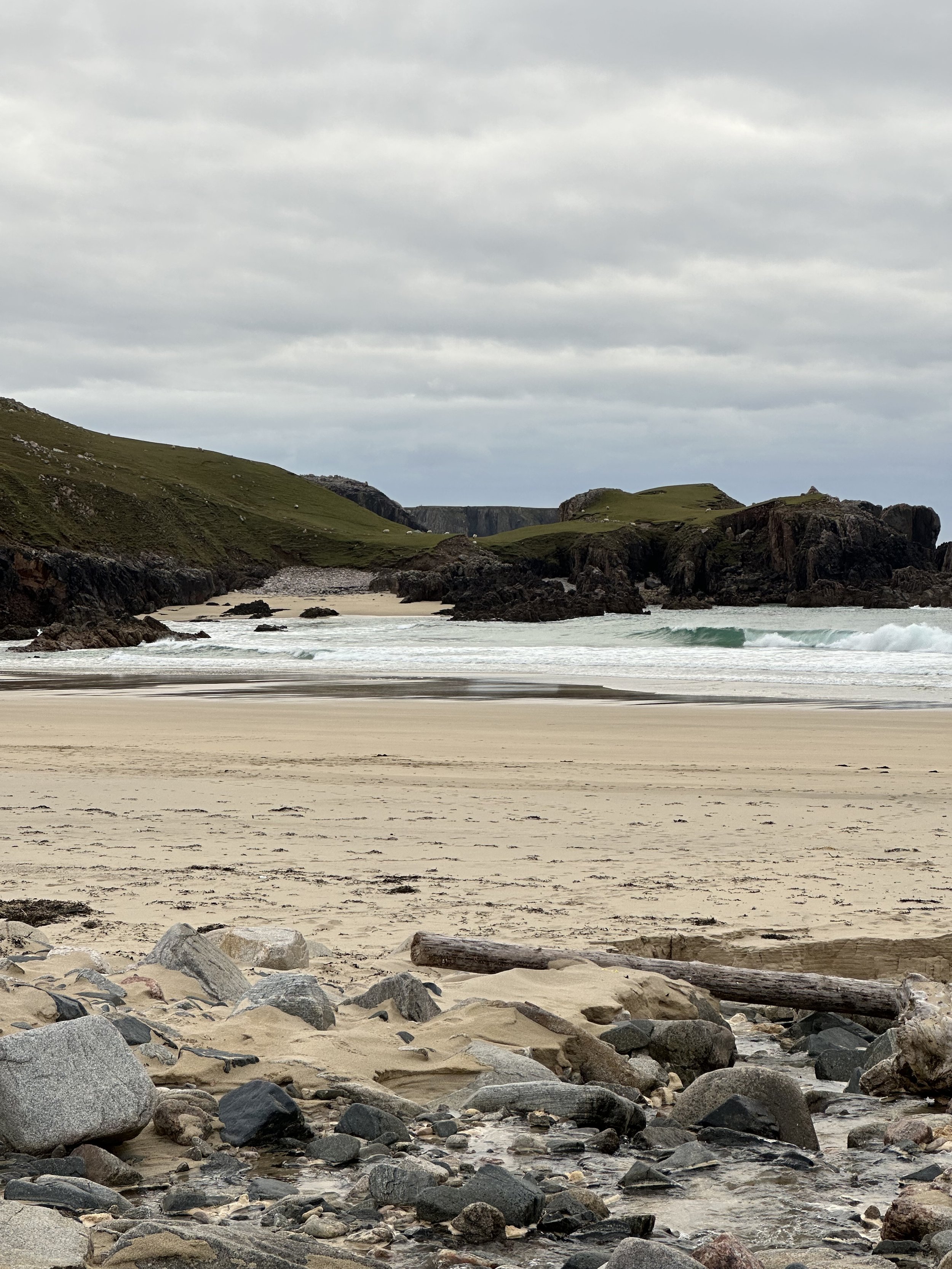 "The sea churns at the mouth of a ragged cove.
Miles wanders onto the beach and drops into the sand. "
(p47)