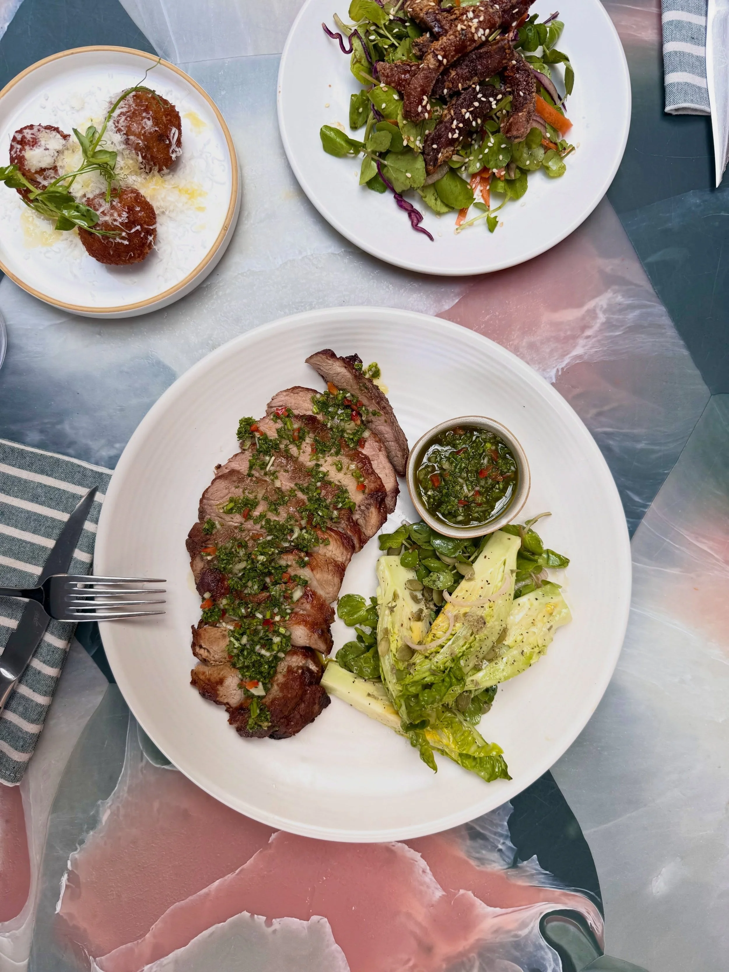 Hot Off The Press: our mouthwatering pork shoulder steak, served with chimichurri, &amp; a baby gem &amp; caper salad 👀

On the menu this weekend &amp; it&rsquo;s not too late to get booked in 🤍