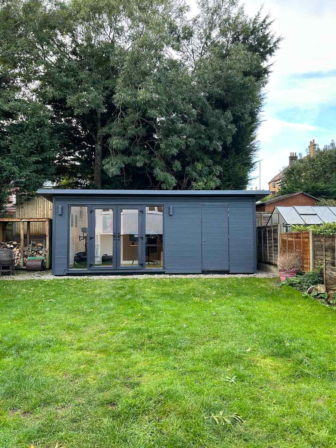 Garden Room Office with Bike Shed in Reigate with Anthracite Grey outside, windows and doors, with home office in garden.