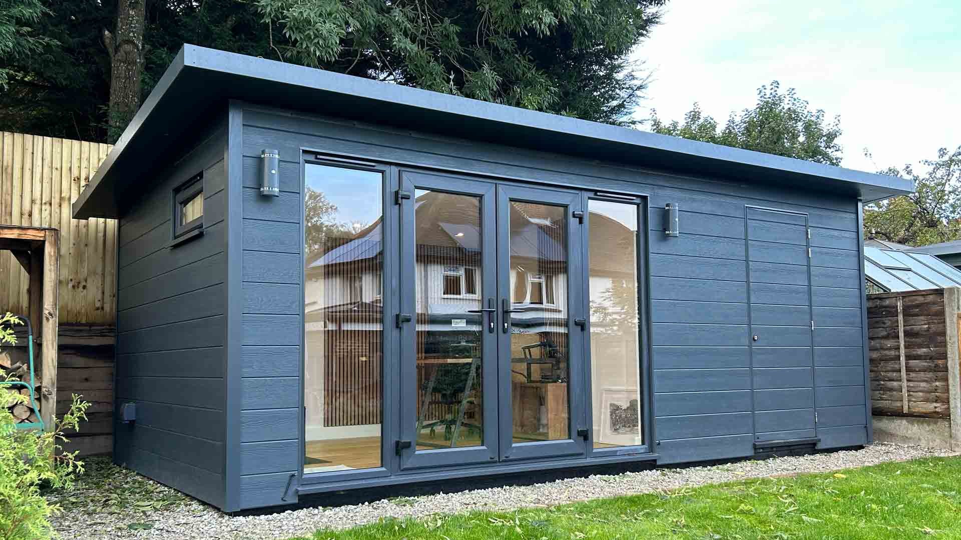 Garden Room Office with Bike Shed in Reigate with Anthracite Grey outside, windows and doors, with home office in garden.