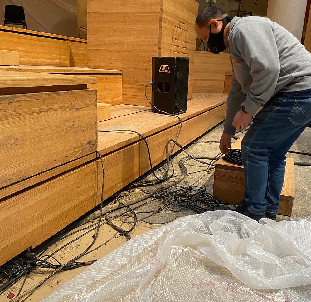 Mold remediation and clean up began quickly following the municipal water main break in 2021. Here we see a person removing electrical wires that have been damaged.