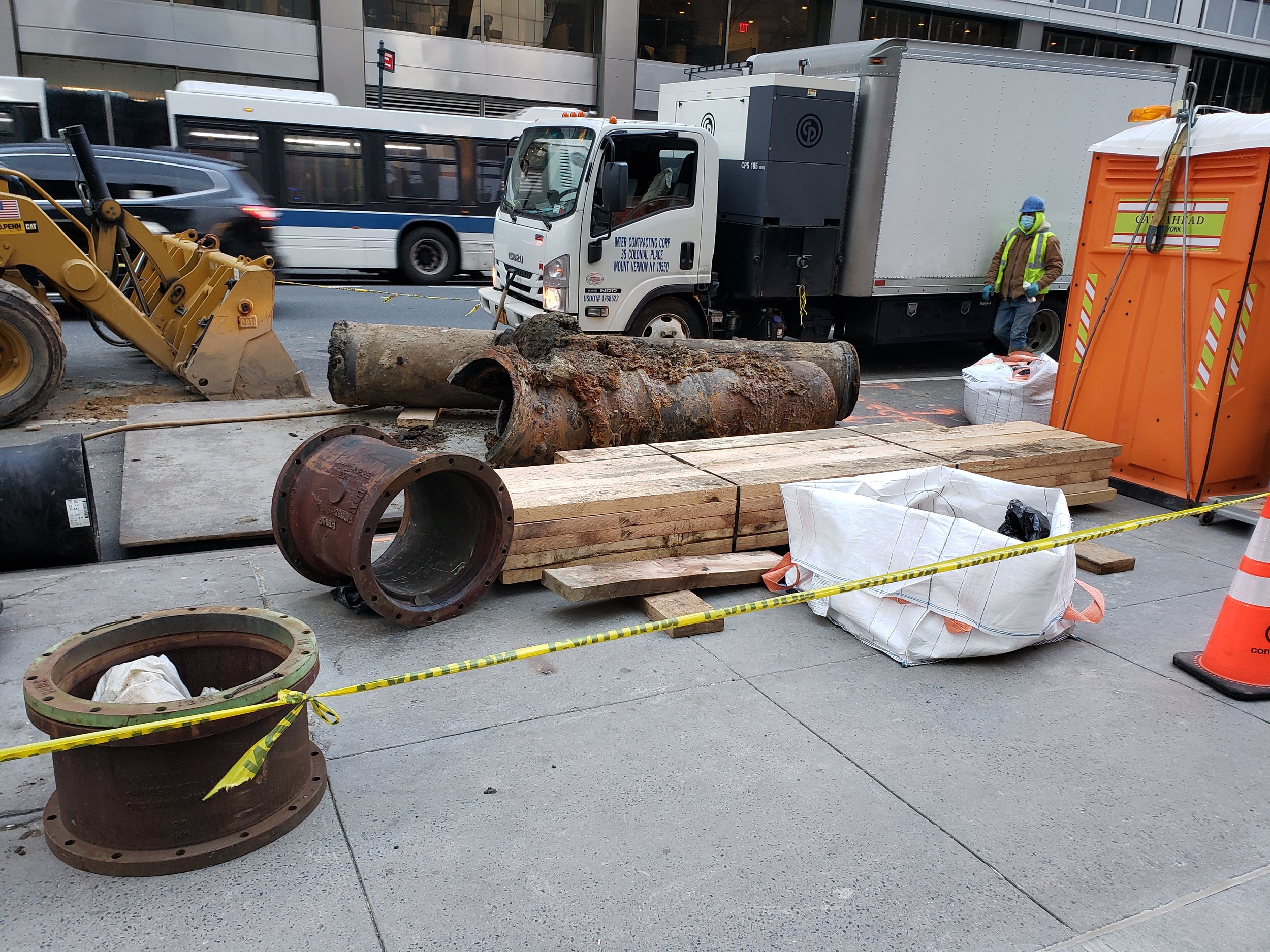 The sidewalk on Lexington Avenue with a large broken pipe that sent water and mud flowing into the building and requiring full overhaul of the multiple spaces.