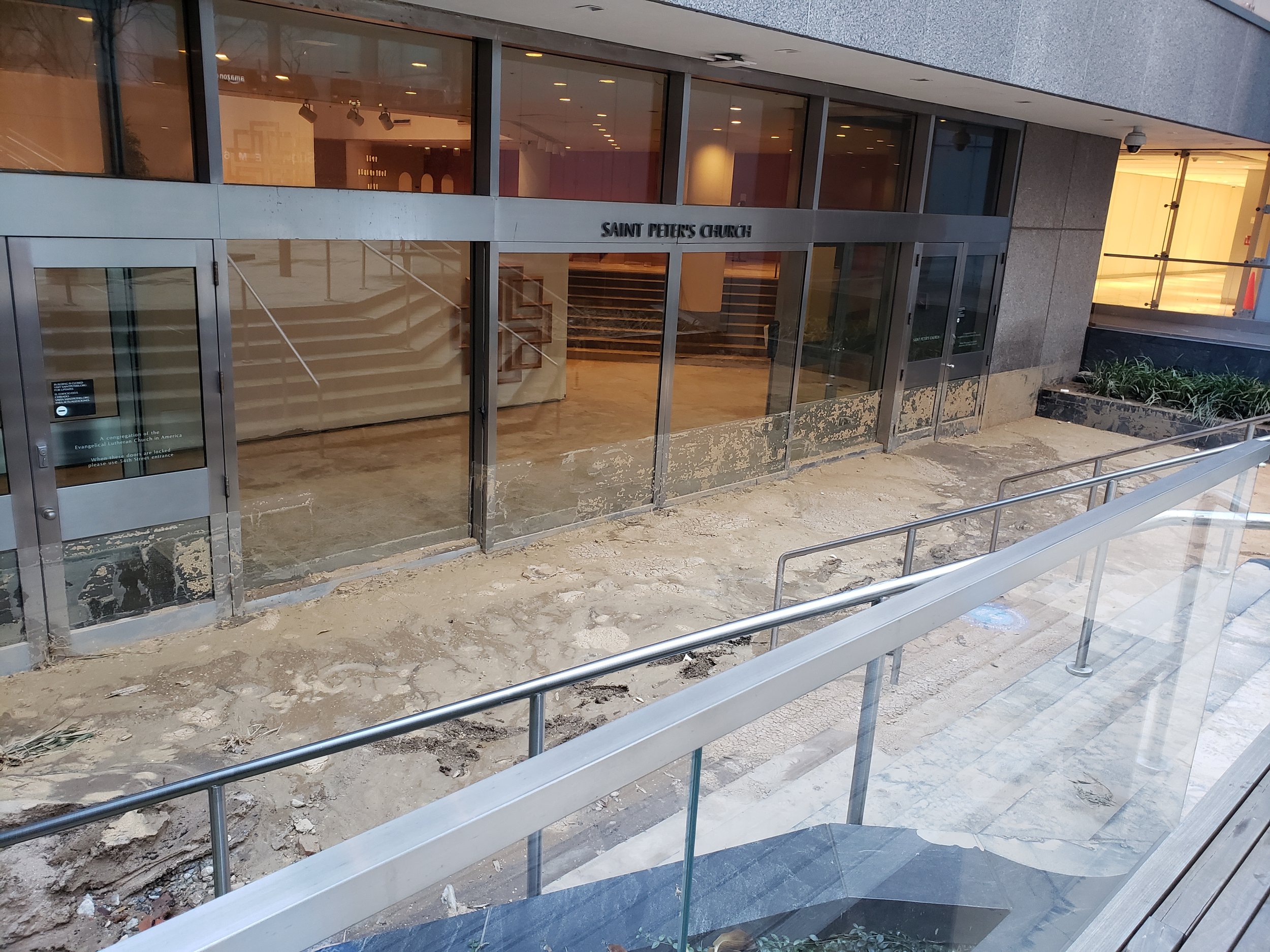 An image of the immediate destruction viewed from the Plaza following the municipal water main break in 2021 that sent water and mud flowing into the building and requiring full overhaul of the multiple spaces.