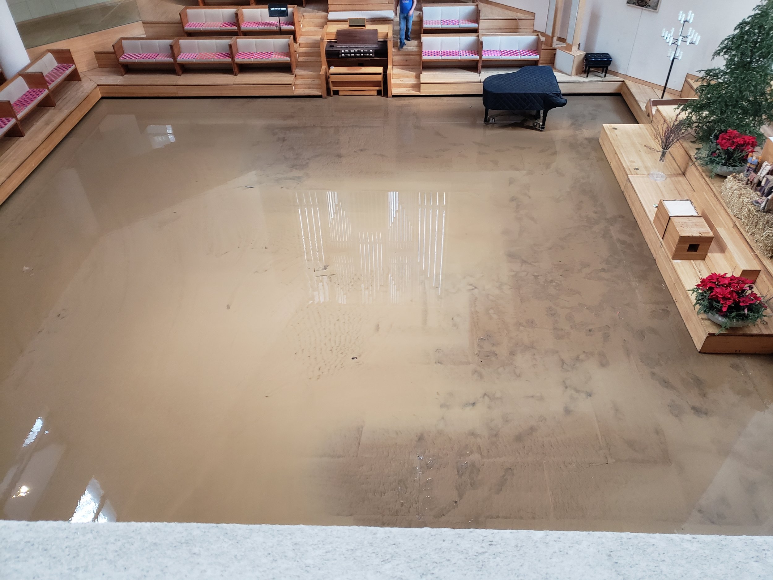 An image of the flooding in the Vignelli-designed interiors following the municipal water main break in 2021 that sent water and mud flowing into the building and requiring full overhaul of the multiple spaces.