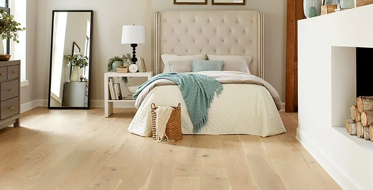 Wide plank floor showing subtle seasonal gaps between boards