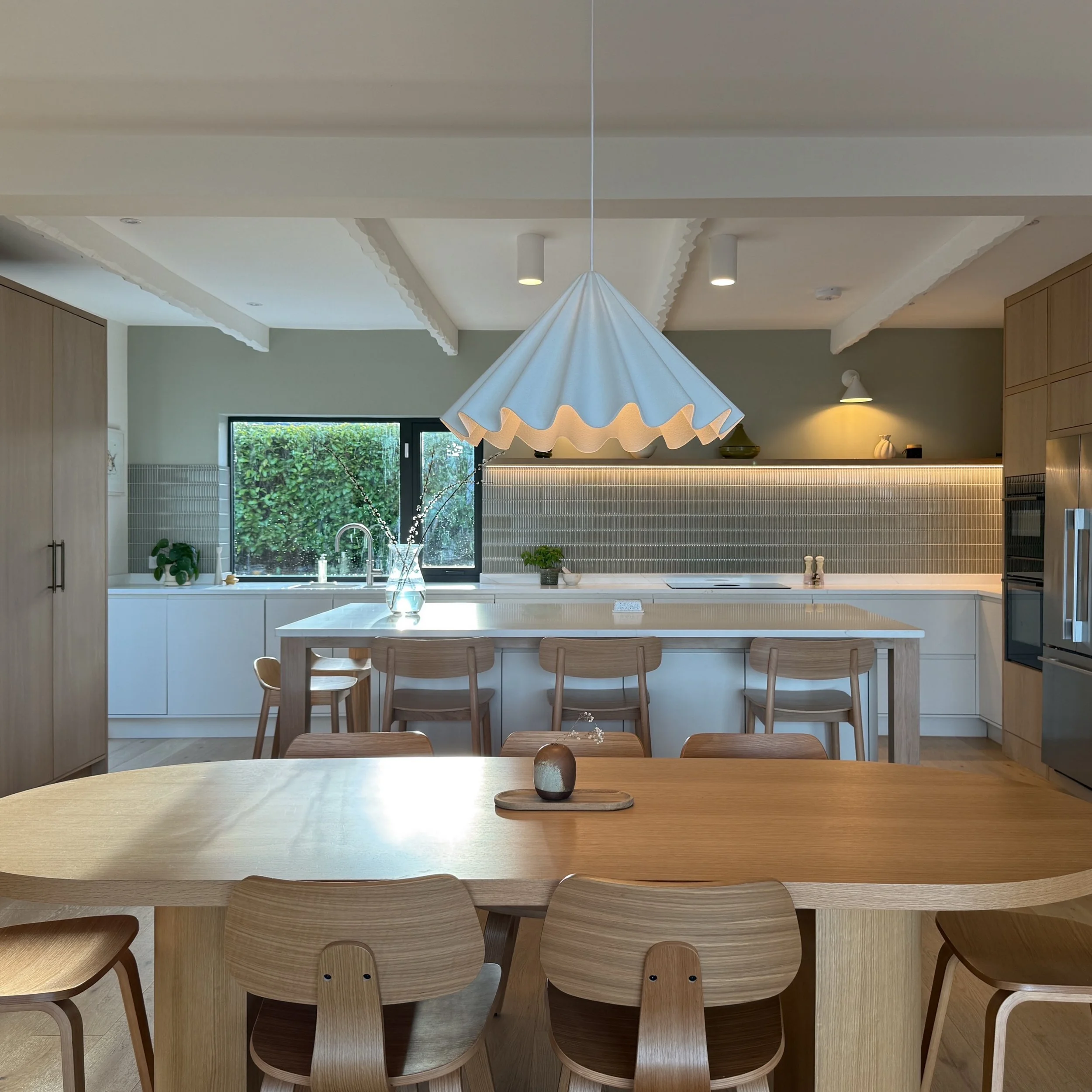 How is this already two years ago?

I designed this kitchen back in 2024 for a family who had moved home from Canada and were settling into life in the beautiful Wicklow Valley.

Soft greens, warm oak and a lovely view of the garden. I still have suc