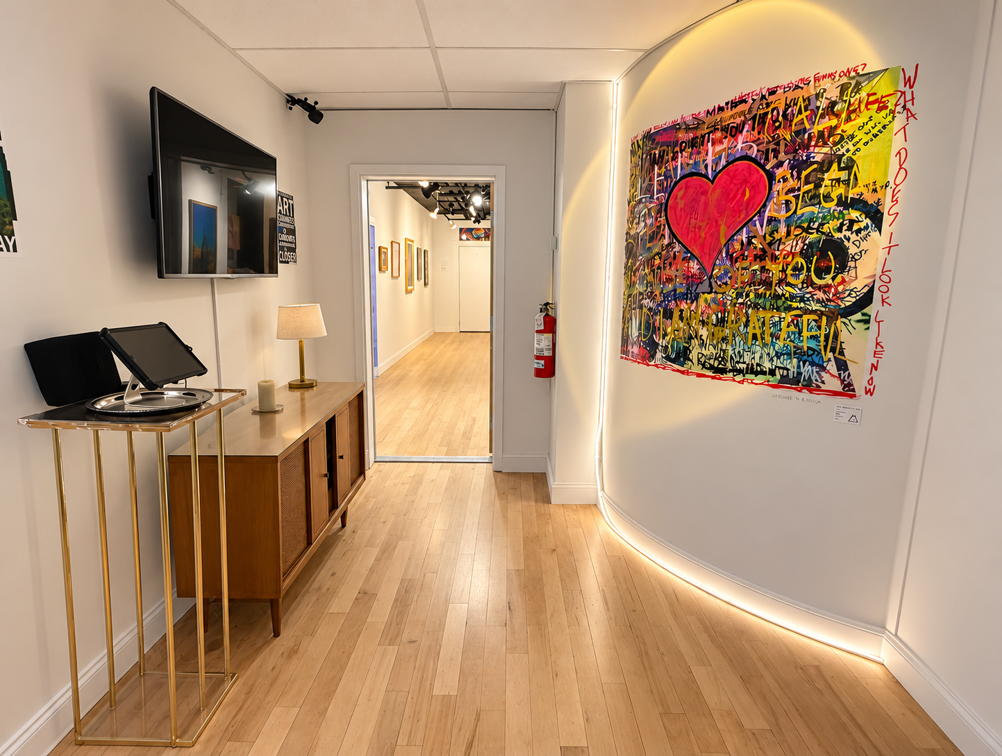 A transitional space where artwork, furniture, sound, and architectural lighting begin to blur the line between gallery and environment.