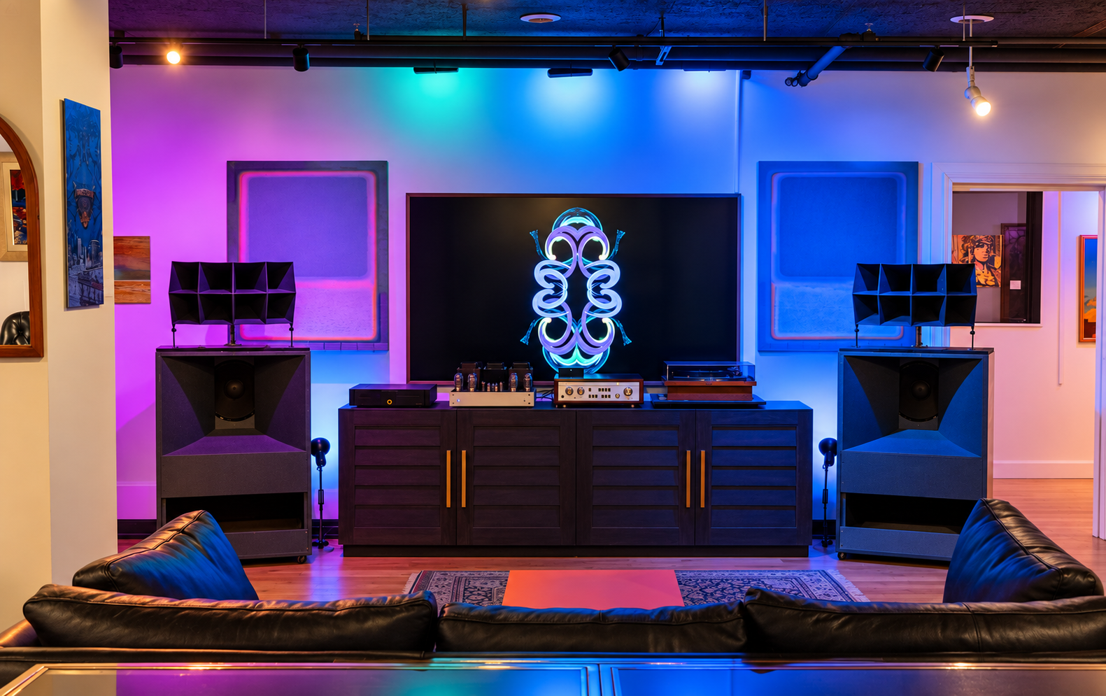 The main gallery in one of its many configurations, with changing digital work and lighting altering the character of the room.