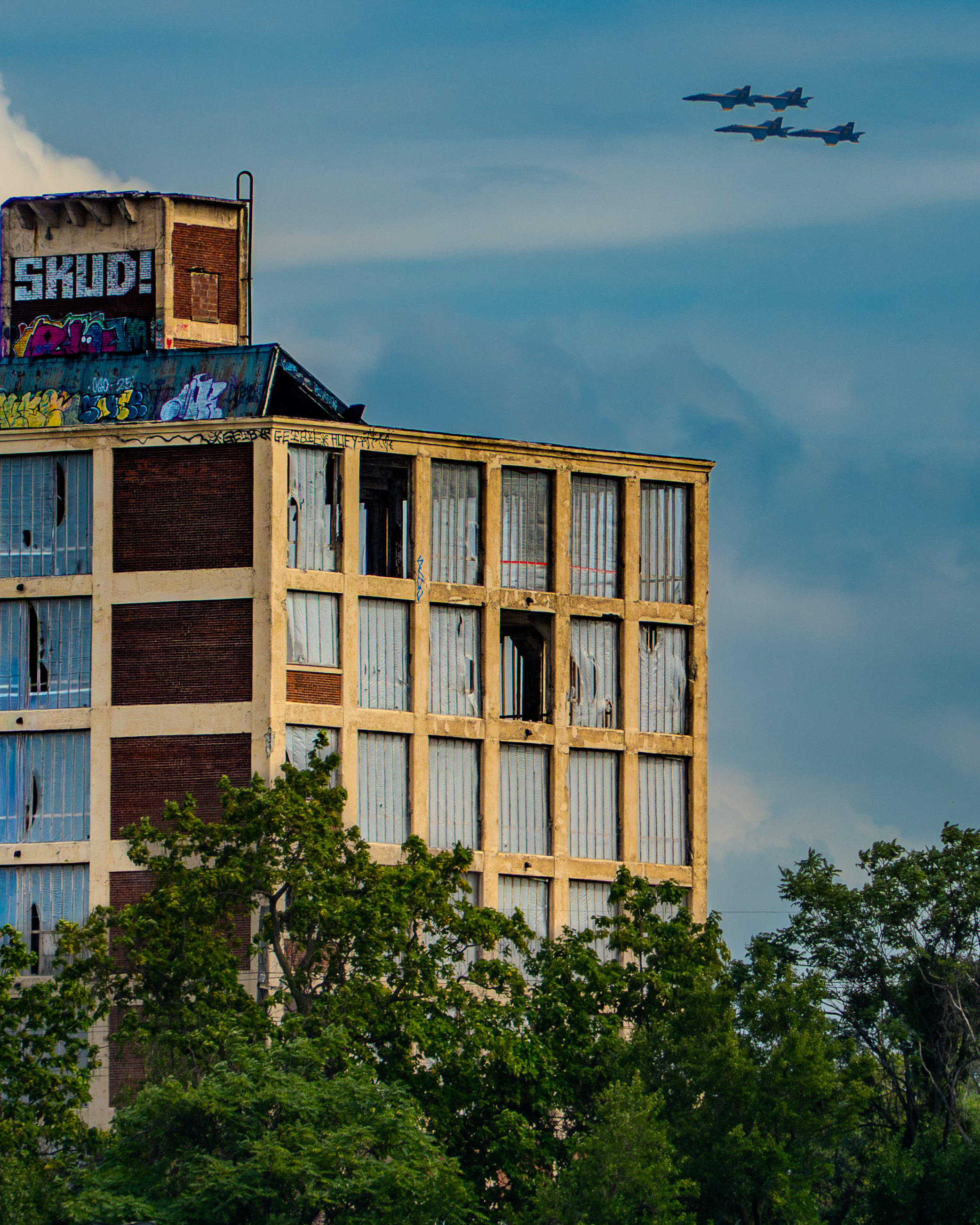 Meanwhile, Overhead | Blue Angels and Industrial Building