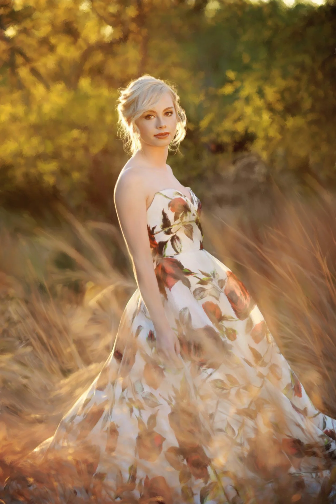 A woman in a floral dress standing in a field during sunset or golden hour.