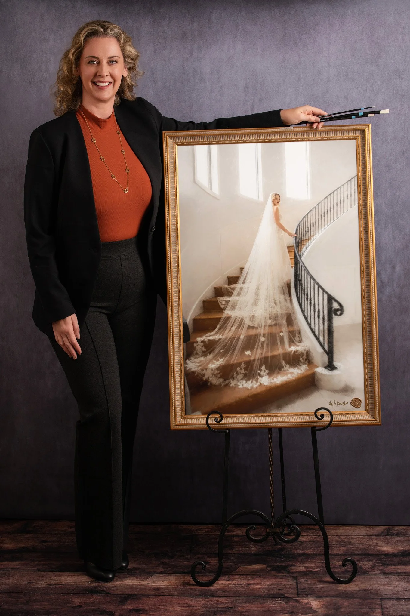Heidi Knight displaying a finished commissioned bridal mixed media portrait — hand-embellished on archival canvas from a wedding photograph, custom framed by Heidi Knight Fine Art, Wimberley, Texas.