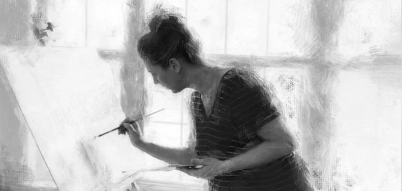 Portrait artist Heidi Knight applying hand-painted embellishments to a commissioned canvas portrait in her Wimberley Texas studio.