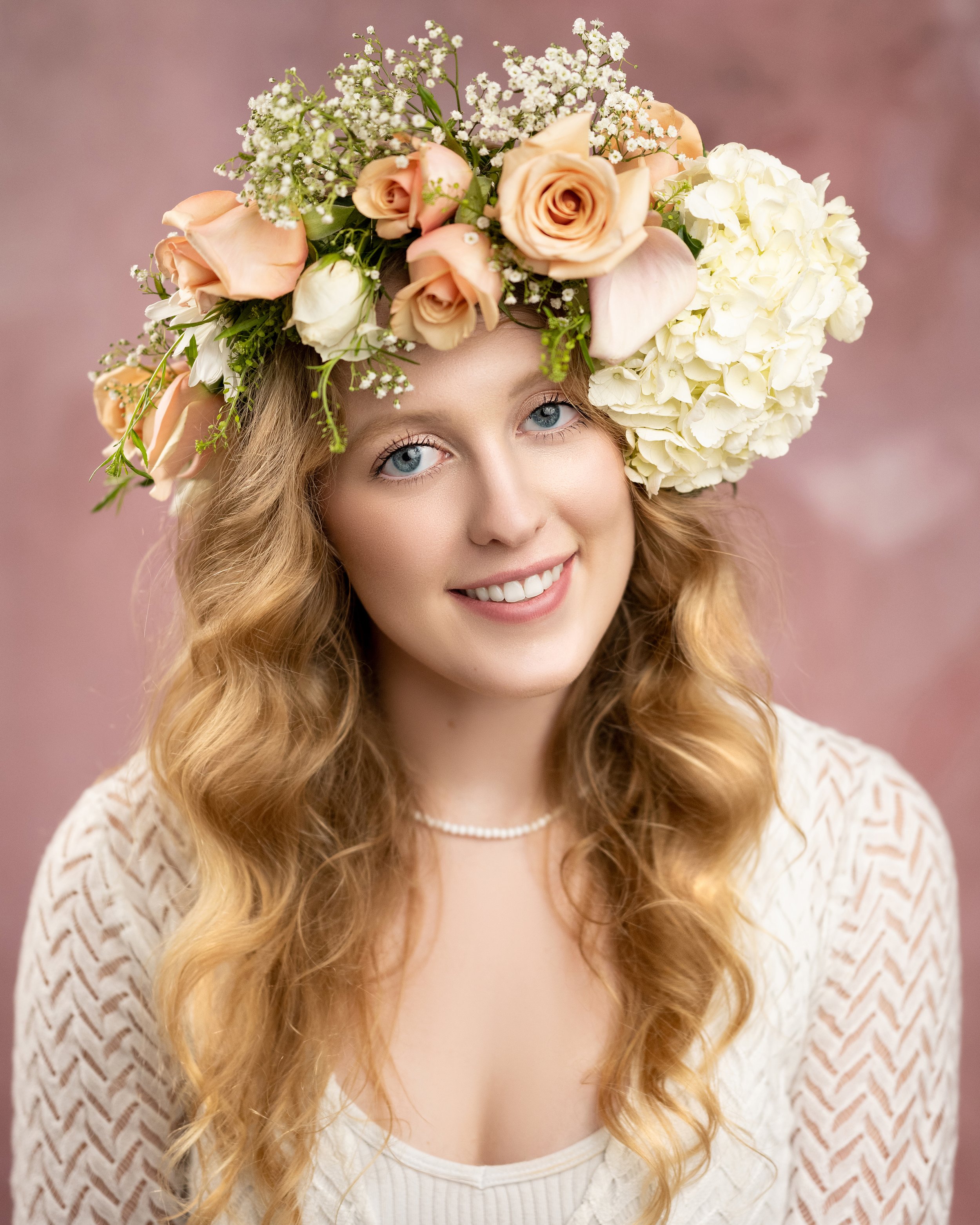 An heirloom portrait by Heidi Knight of a older sister and teen girl wearing an elaborate flower crown.