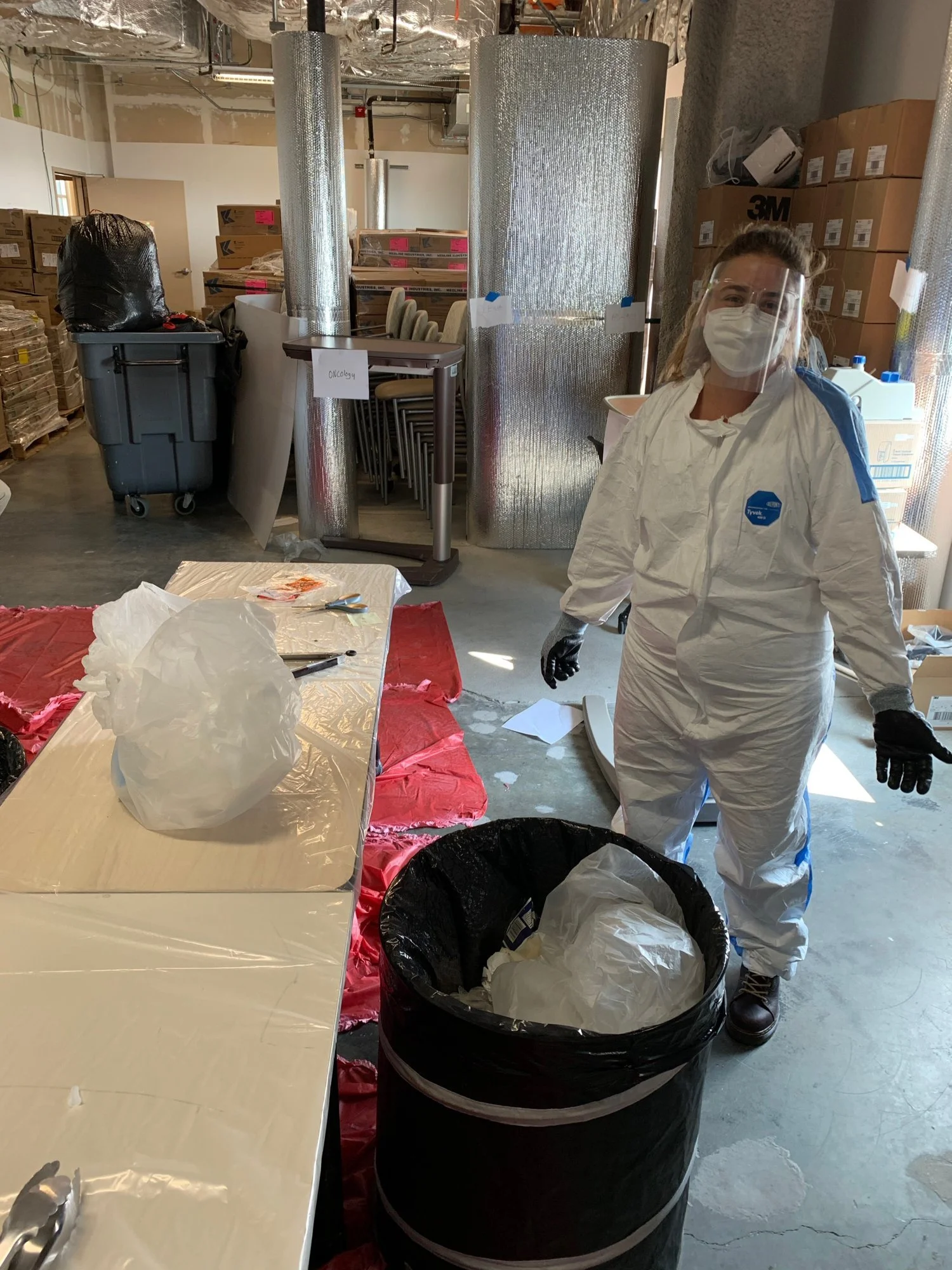 María López Godoy of Waste Free Tahoe in protective gear at a sorting station during a waste audit