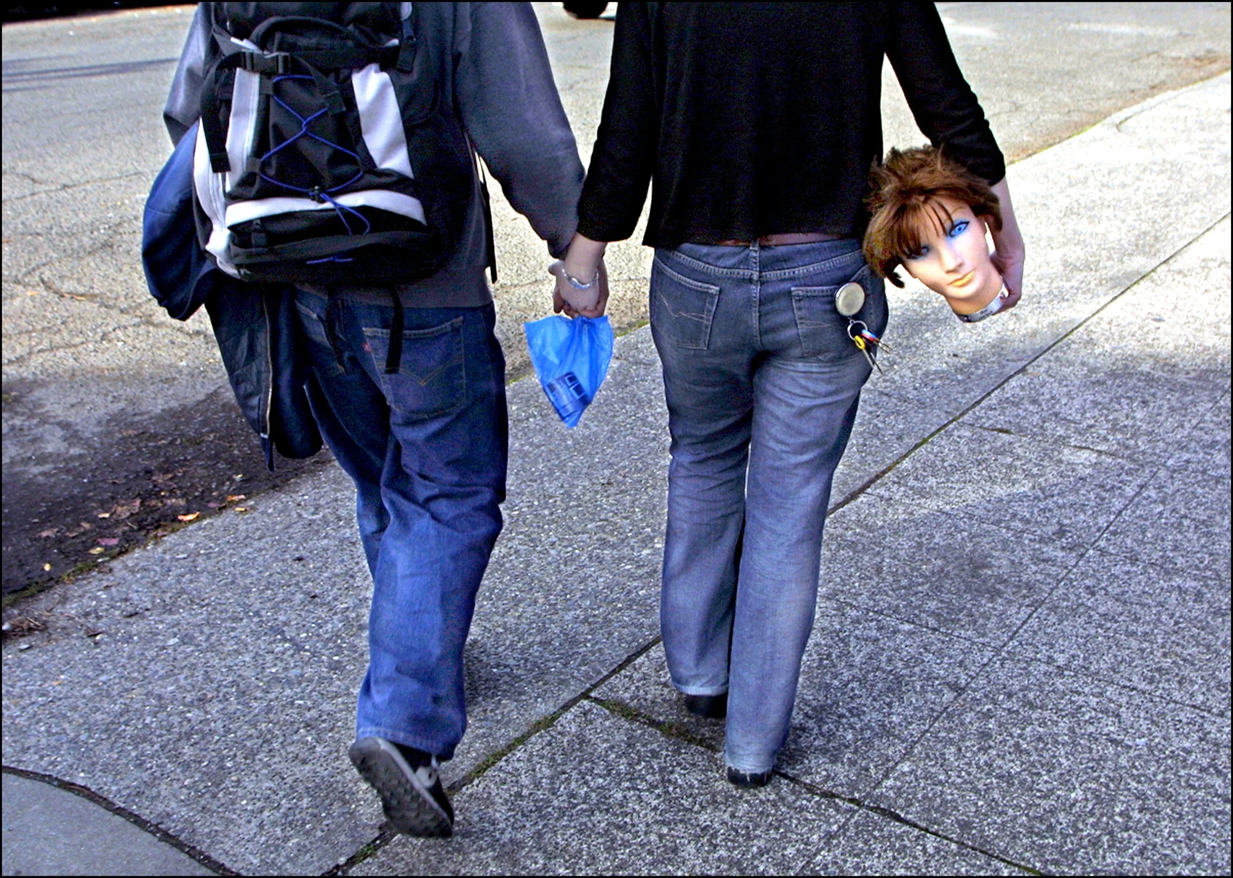 Seattle, Washington beauty-school student, Cherie Halikas, gracefully carries her homework under her arm as she heads to class. ©Thomas James Hurst/The Seattle Times
