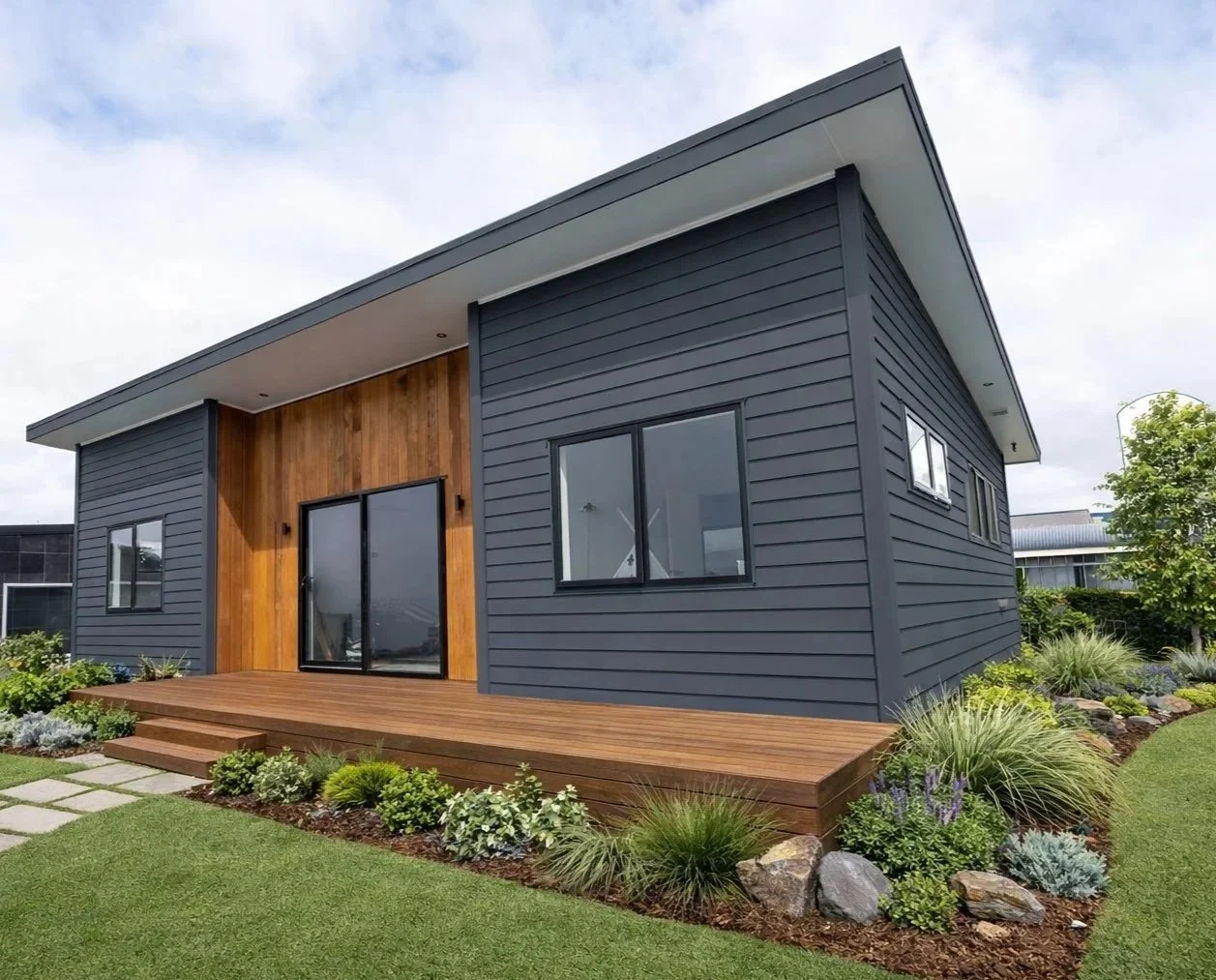 Weatherboard house with deck painted black