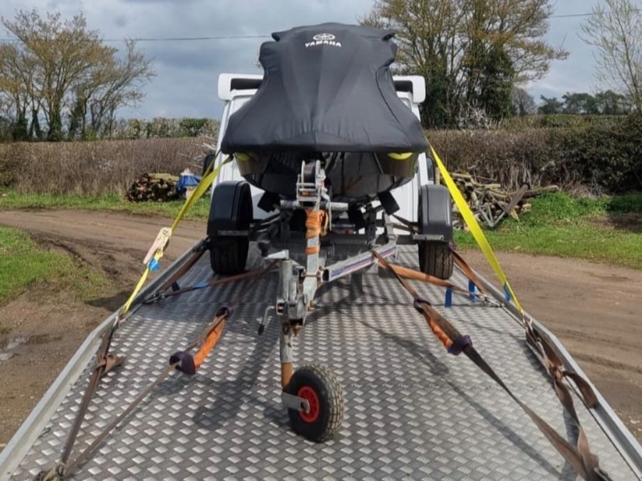 Transporting a jet ski with our towing service