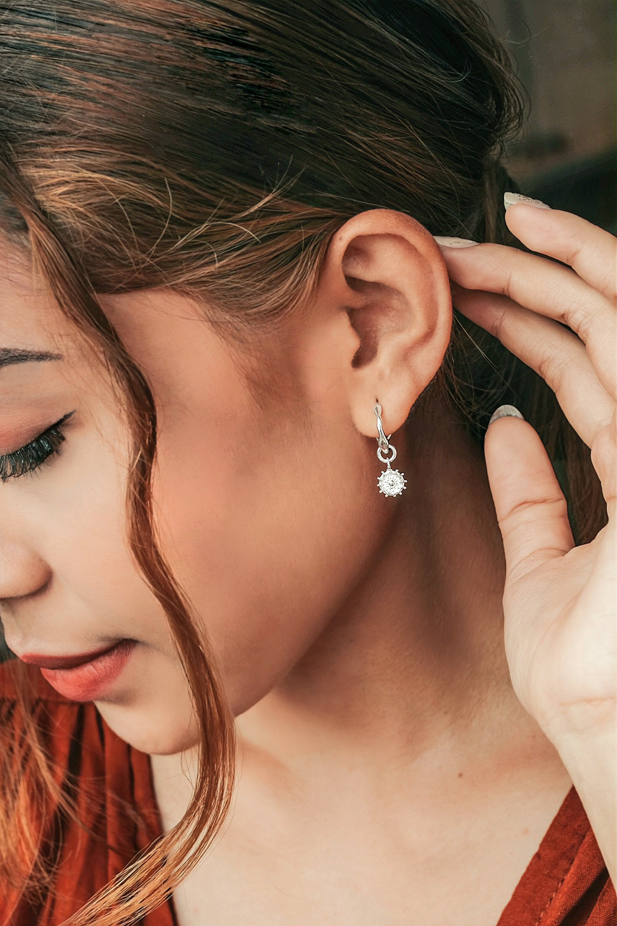 model wearing tribal earring silver