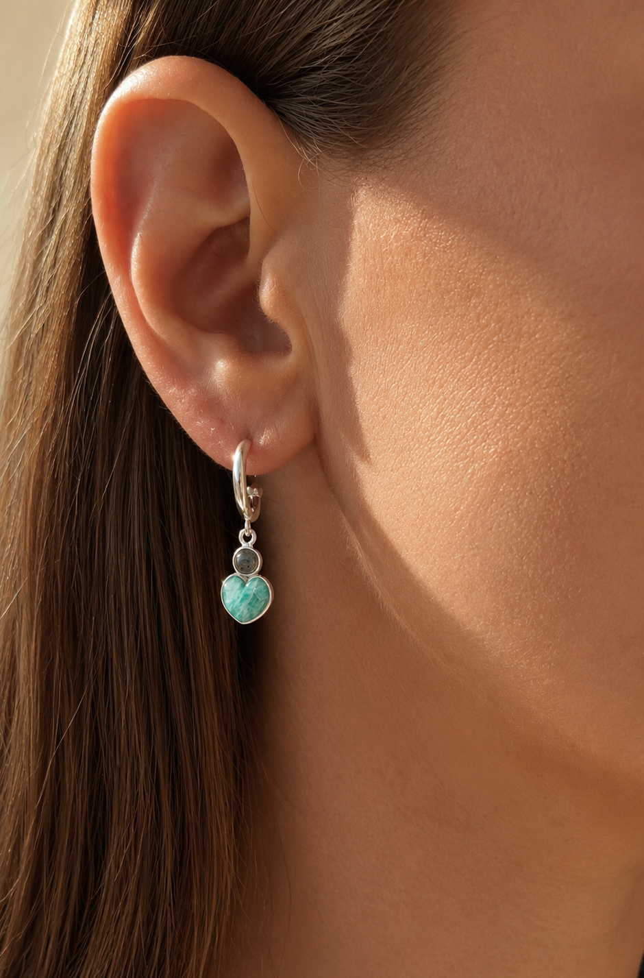 Model ear amazonite heart hoop earrings.png