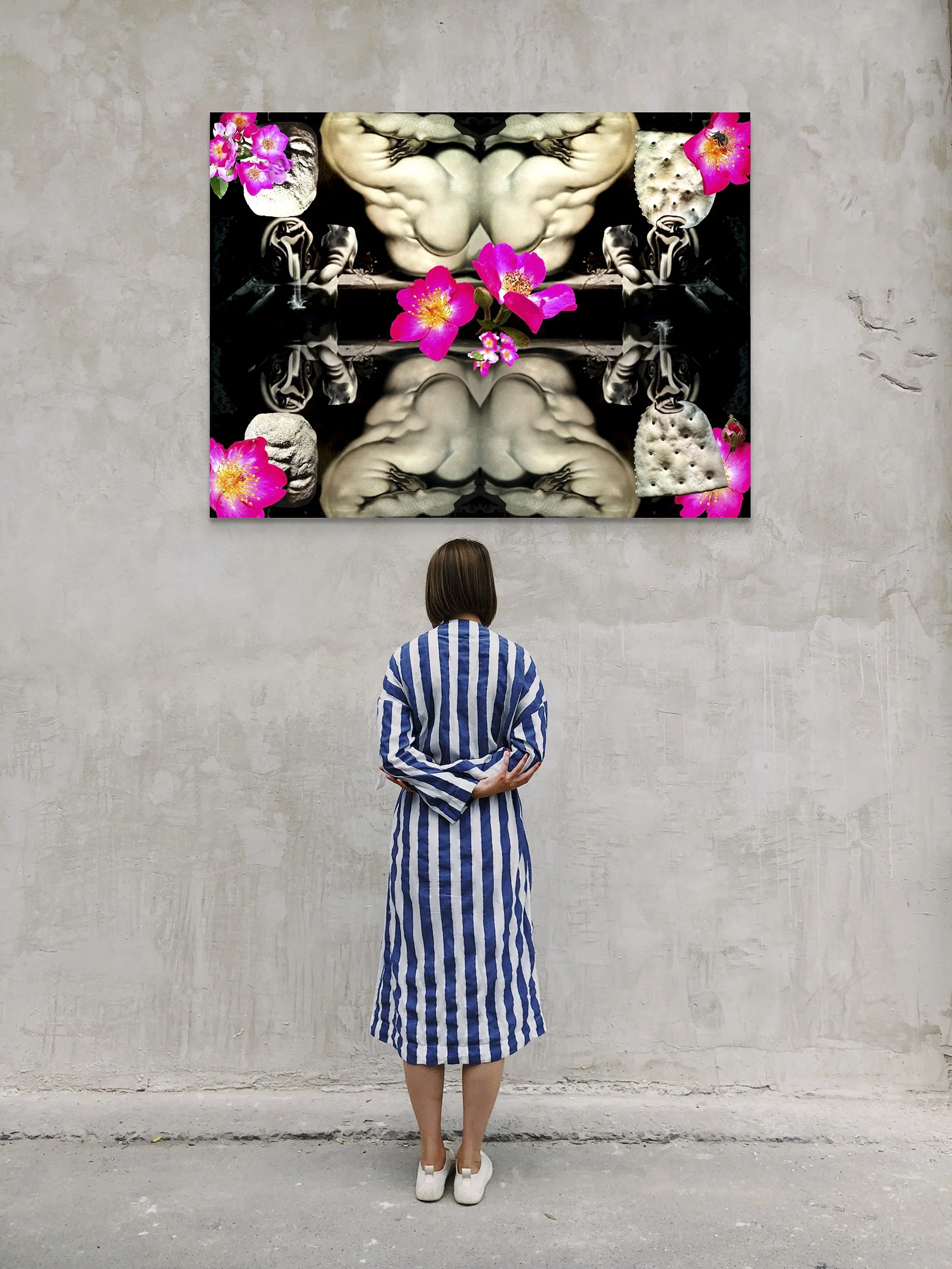 This mock-up shows print of Surreal digital composite, Rubenesque Dark Garden:  Reflecting Pool, installed on distressed concrete gallery wall, with gallery visitor.