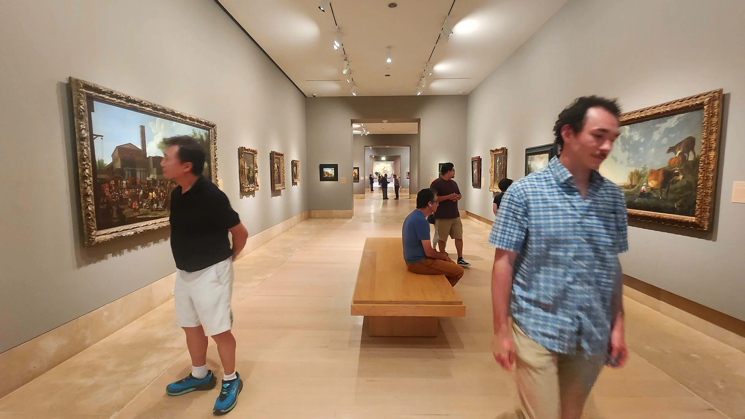 Visitors viewing European paintings in a spacious gallery at the Norton Simon Museum in Pasadena, California.