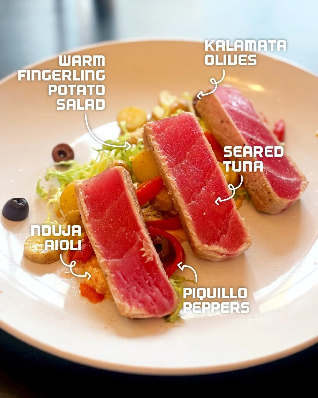 It&rsquo;s #NationalSeafoodMonth, and we&rsquo;re celebrating in style. Indulge in our seared tuna appetizer, served with warm fingerling potato salad, Kalamata olives, bright orange, piquillo peppers, and a touch of nduja aioli&mdash;flavors that pr