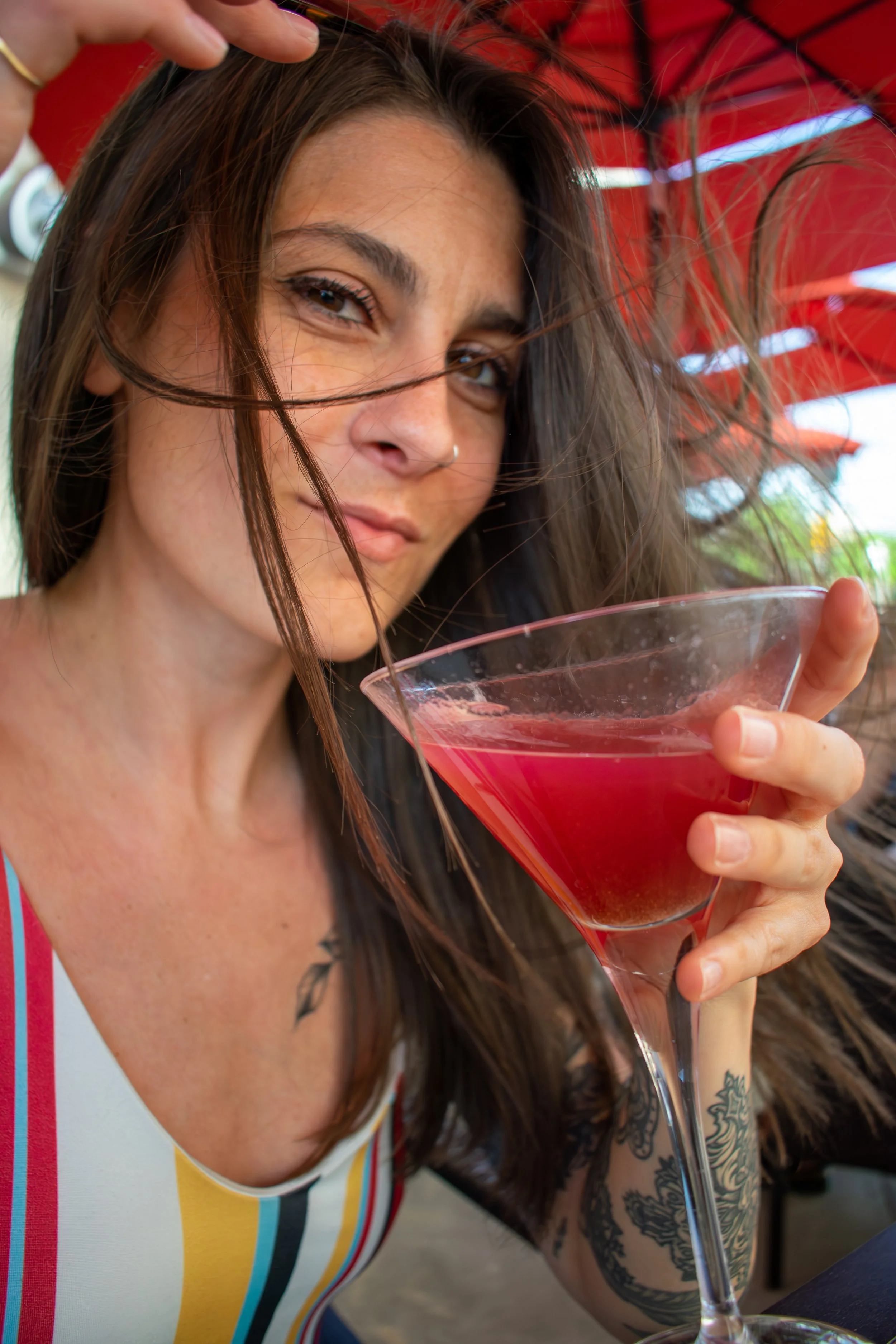 woman-drinking-pear-tini-on-crave-patio-eat-drink-crave-2023.jpg