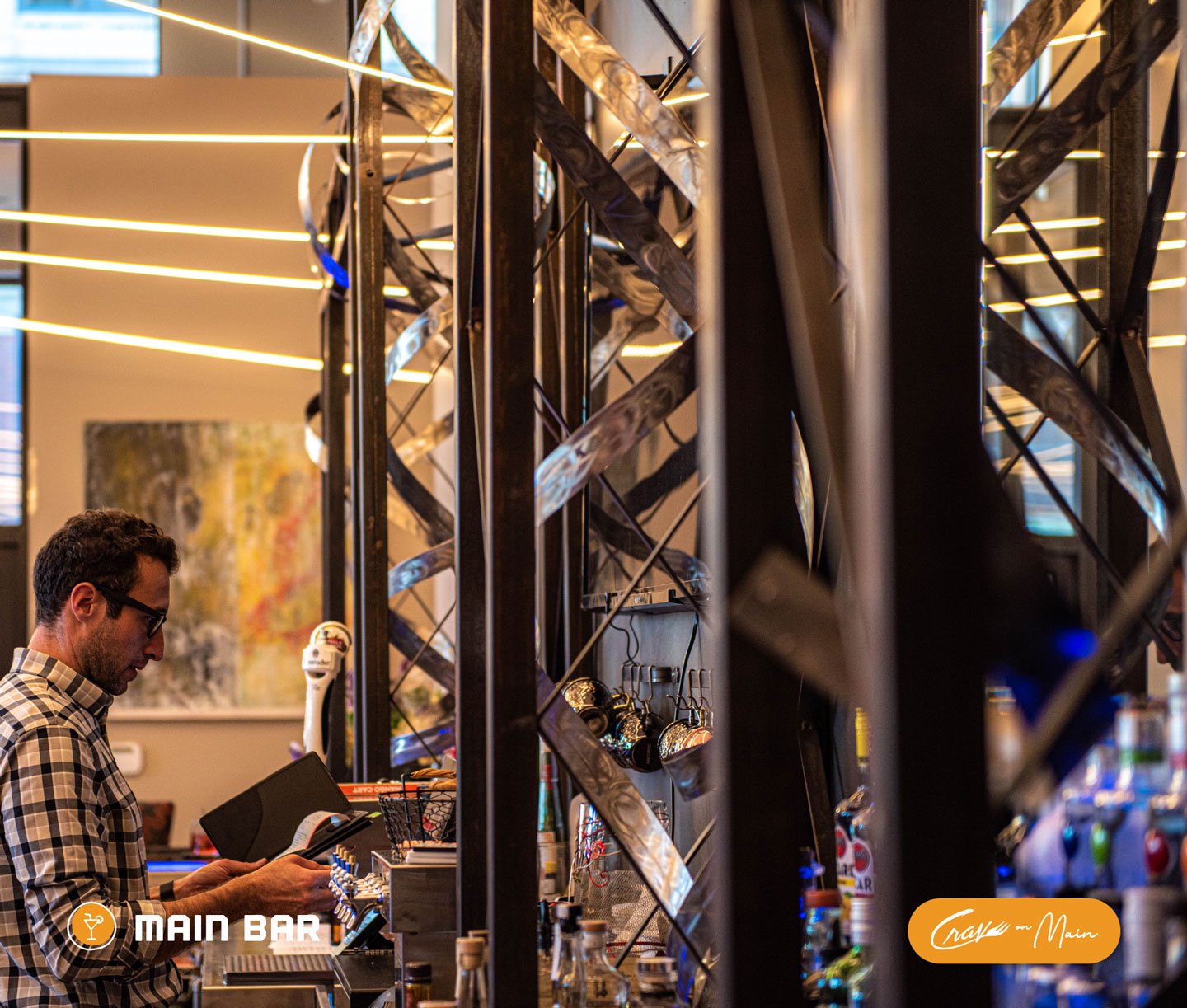 18-bartender-alex-at-main-bar-register-communale-sculpture-eat-drink-crave-main-street.jpg